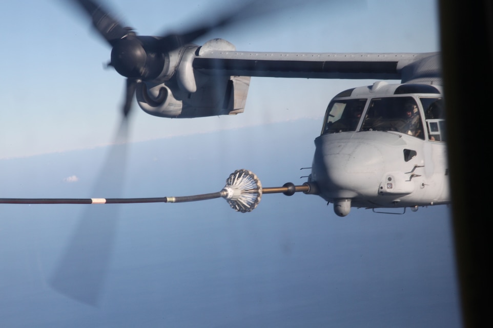 An MV-22 Osprey with Marine Medium Tiltrotor Squadron 264 performs a “dry plug” on a fuel line from a KC-130J Hercules with Marine Aerial Refueler Transport Squadron 252, off the coast of North Carolina Jan. 5. A “dry plug” is making a connection with another aircraft without taking on fuel and the training is conducted to improve confidence and muscle memory.