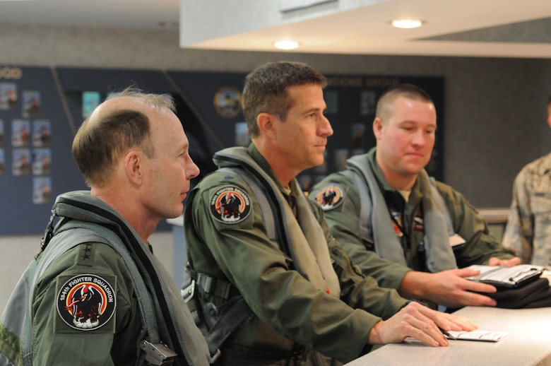 Gen. Charles H. Jacoby, Jr., Commander, North American Aerospace Defense Command and U.S. Northern Command, attends a pre-flight briefing at the 144th Operations Group, California Air National Guard, after completing an F-16 simulator orientation on January 5, 2012.  (U.S. Air Force photo by Master Sgt. David J. Loeffler)