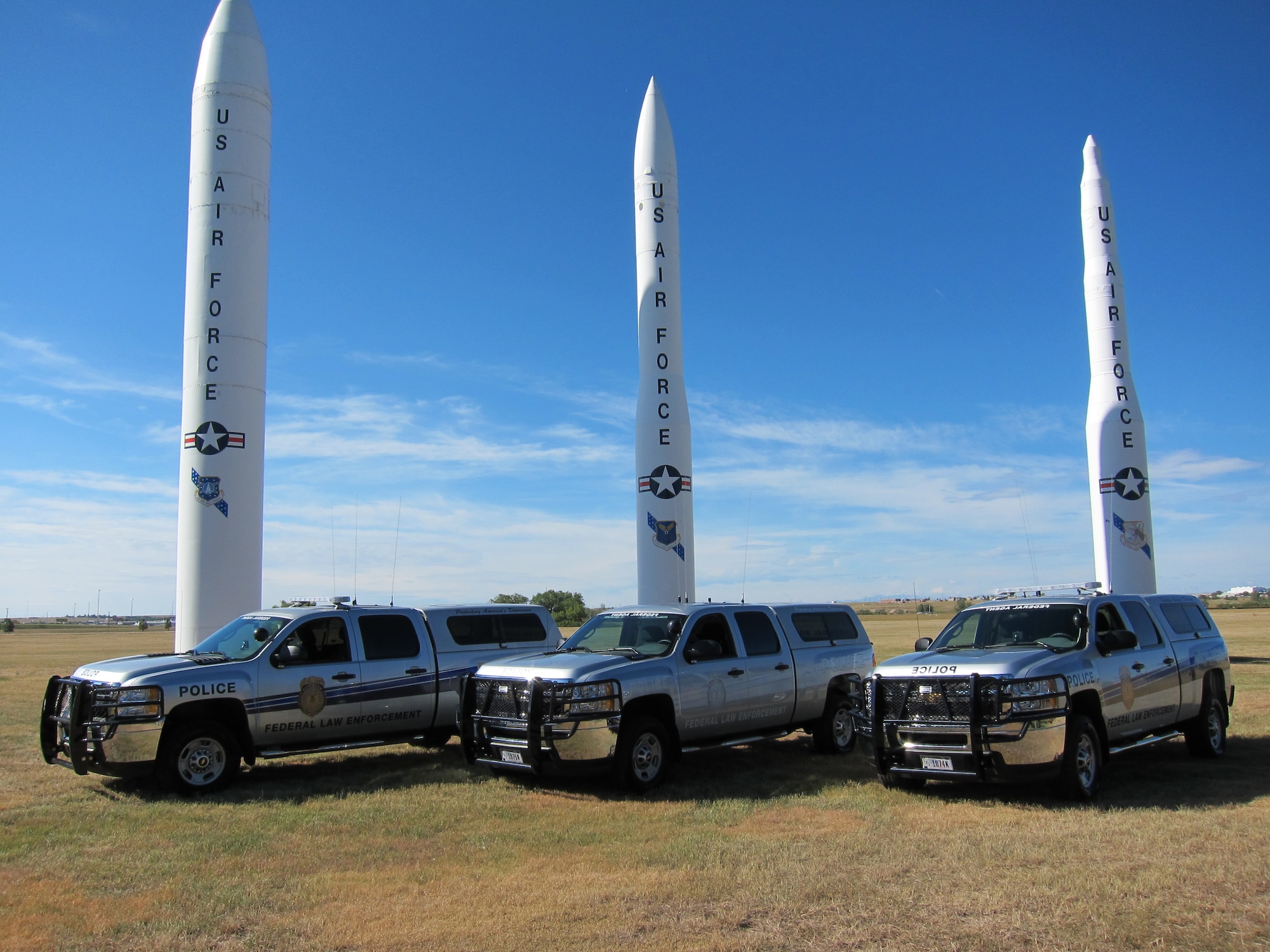 Three of OSI's new trucks stand ready to support the Air Force's Global Strike Mission. (U.S. Air Force Photo)