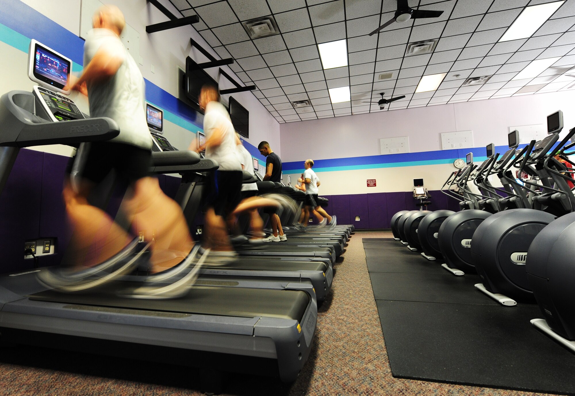 WHITEMAN AIR FORCE BASE, Mo. -- Members of Team Whiteman run on treadmills as part of the 509th Medical Operations Squadron Health and Wellness Center’s Stepping/Running through the Winter event Dec. 22, 2012. Stepping/Running through the winter’s purpose is to encourage individuals to become more physically active throughout the winter season. The program began Dec. 1, 2011 and is scheduled to continue until Feb. 20. (U.S. Air Force photo/Senior Airman Nick Wilson)