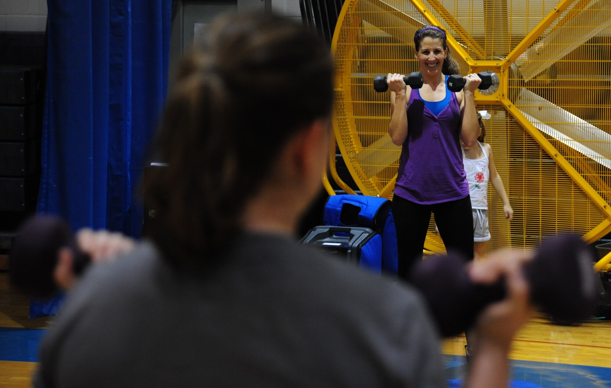 WHITEMAN AIR FORCE BASE, Mo. – Staff Sgt. Wendy Wray, left, 131st Aircraft Maintenance Squadron propulsion technician, participates in a fitness training session led by Kelly Perry, 509th Force Support Squadron fitness center personal trainer, at the fitness center basketball court Dec. 22. The 509th Force Support Squadron’s fitness center will be hosting their annual Wing Fitness Day event Jan. 6 from 10 a.m. to 3 p.m. The event will be used to introduce new instructors and their classes and demonstrate various fitness center activities. (U.S. Air Force photo/Senior Airman Nick Wilson)