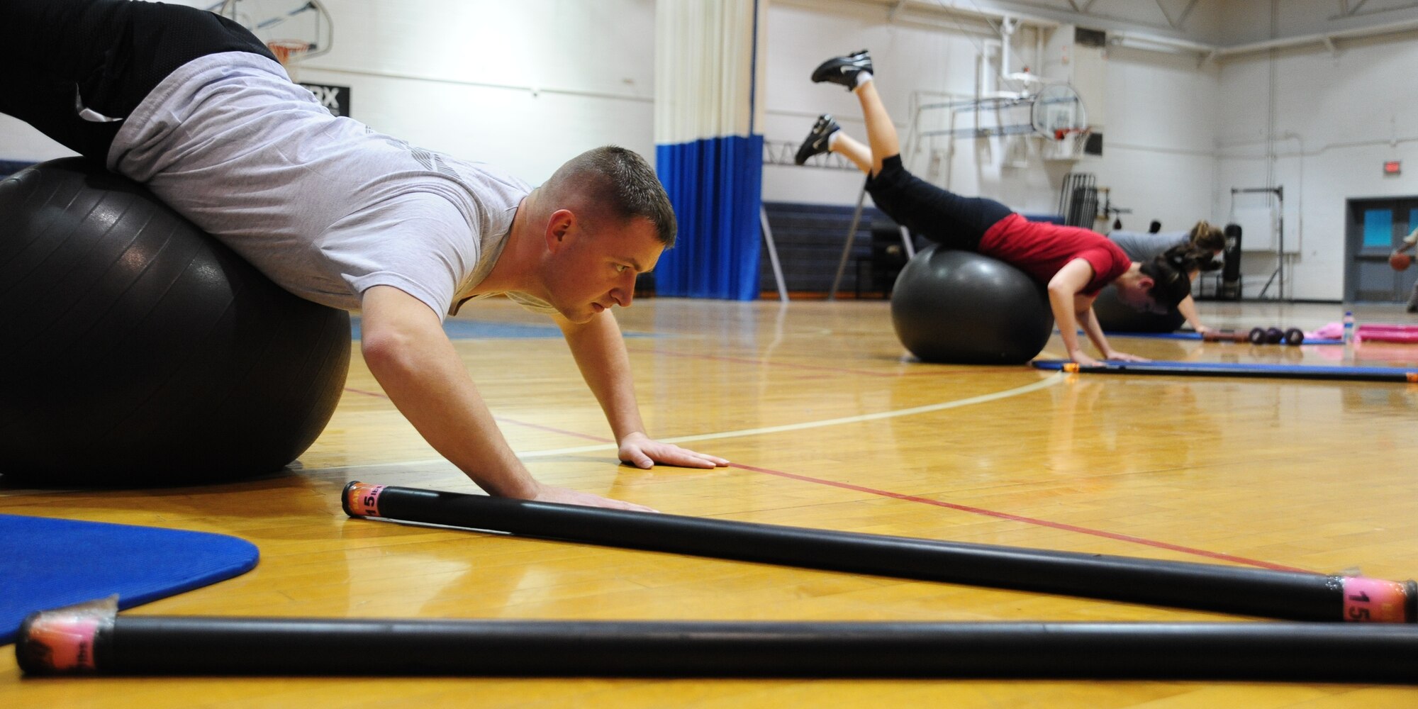 WHITEMAN AIR FORCE BASE, Mo. – Staff Sgt. Jacob Byers, 509th Logistics Readiness Squadron vehicle operator dispatcher, participates in a fitness training session led by a personal trainer at the fitness center basketball court Dec. 22. The 509th Force Support Squadron’s fitness center will be hosting their annual Wing Fitness Day event Jan. 6 from 10 a.m. to 3 p.m. The event will be used to introduce new instructors and their classes and demonstrate various fitness center activities. (U.S. Air Force photo/Senior Airman Nick Wilson)