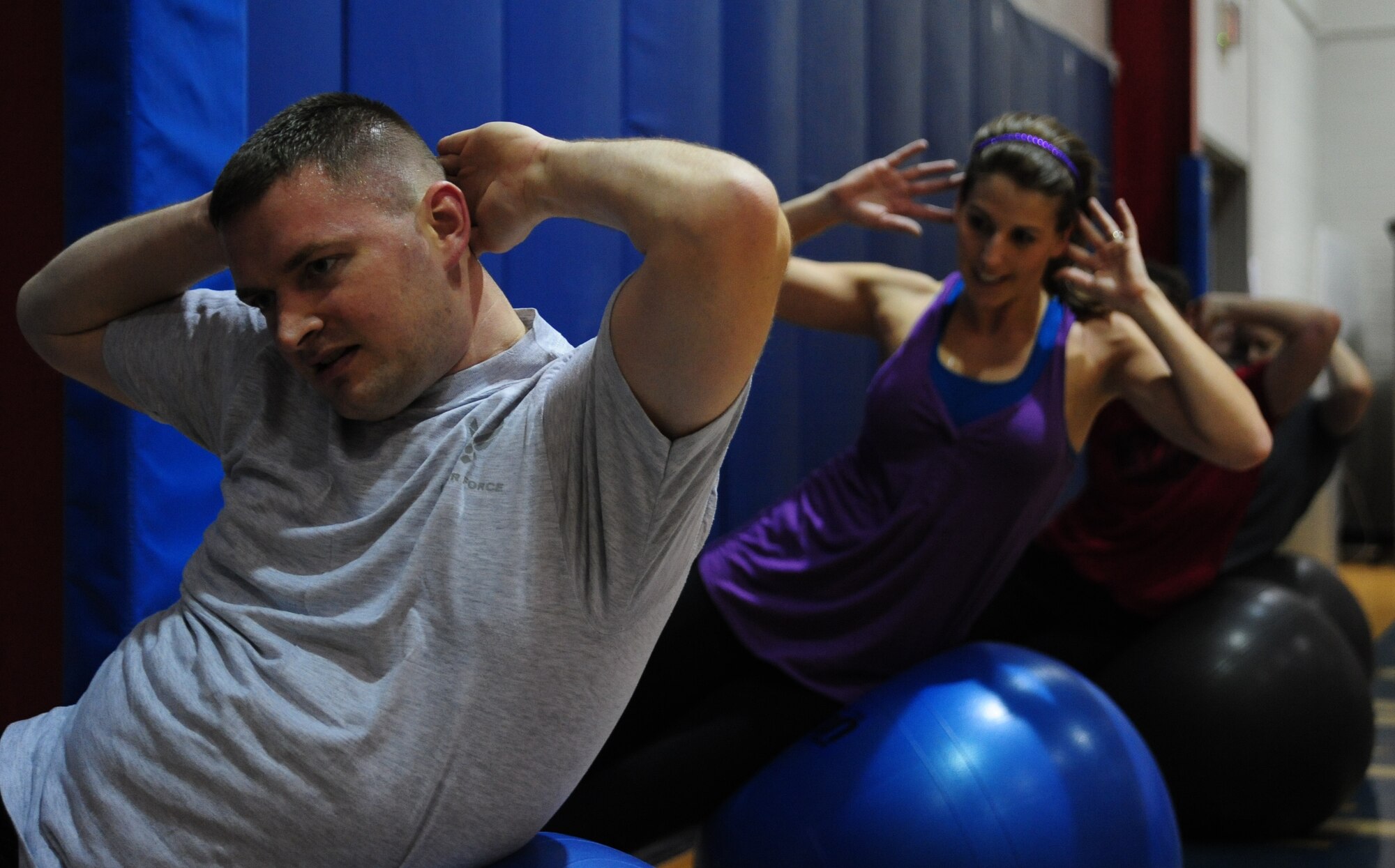 WHITEMAN AIR FORCE BASE, Mo. – Members of the base community participate in a fitness training session led by a personal trainer at the fitness center basketball court Dec. 22. The 509th Force Support Squadron’s fitness center will be hosting their annual Wing Fitness Day event Jan. 6 from 10 a.m. to 3 p.m. The event will be used to introduce new instructors and their classes and demonstrate various fitness center activities. (U.S. Air Force photo/Senior Airman Nick Wilson)