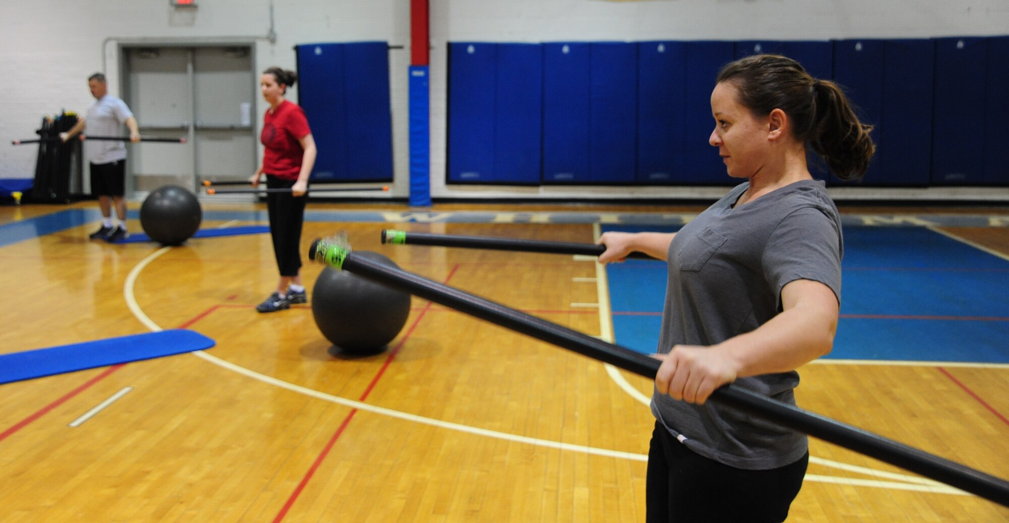WHITEMAN AIR FORCE BASE, Mo. – Members of the base community participate in a fitness training session led by a personal trainer at the fitness center basketball court Dec. 22. The 509th Force Support Squadron’s fitness center will be hosting their annual Wing Fitness Day event Jan. 6 from 10 a.m. to 3 p.m. The event will be used to introduce new instructors and their classes and demonstrate various fitness center activities. (U.S. Air Force photo/Senior Airman Nick Wilson)