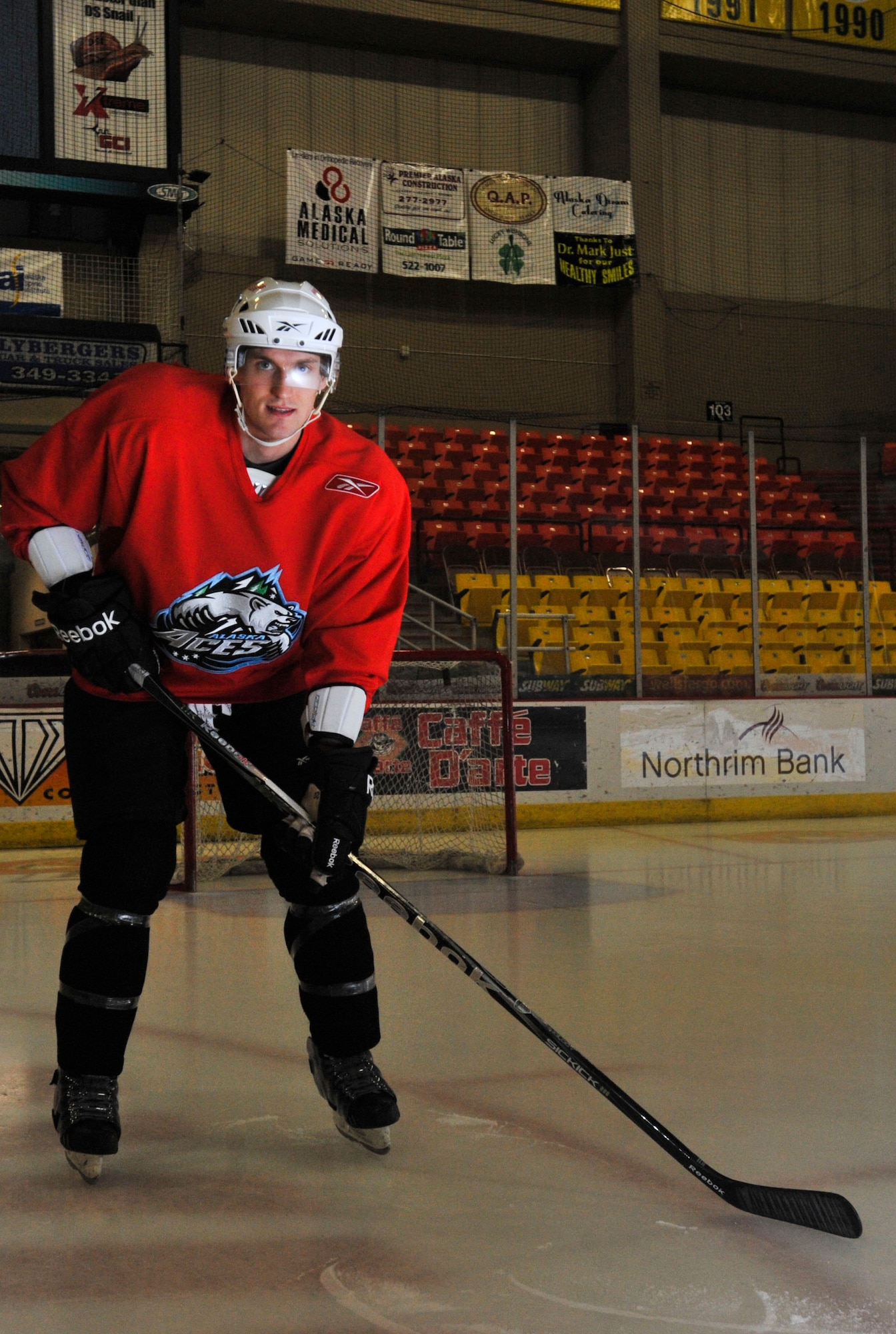 ANCHORAGE, Alaska  –  Jacques Lamoureux, left wing for the Alaska Aces, poses for a picture before practice at the Sullivan Arena Dec. 29. Lamoureaux not only plays professional hockey with the Aces, he’s also a second lieutenant assigned to the 673d Contracting Squadron at Joint Base Elmendorf-Richardson. (U.S. Air Force photo/Senior Airman Christopher Gross)
