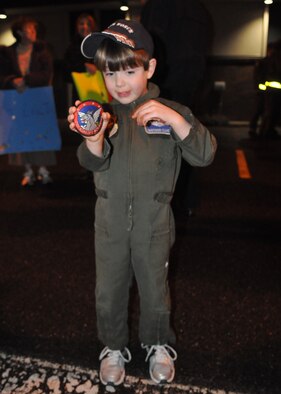 Nathan Cline awaits the return of his father, Lt. Col. Ira Cline, as the 4th Airlift Squadron returned Jan. 4, 2012, at Joint Base Lewis-McChord, Wash. During their deployment, the C-17 squadron flew 951 sorties, equaling more than 3,056 hours, moving more than 50,328 passengers and delivering more than 29.9 million pounds of combat sustainment cargo for U.S. military forces in Iraq, Afghanistan and operations in East Africa. (U.S. Air Force photo/Tech. Sgt. Oshawn Jefferson)