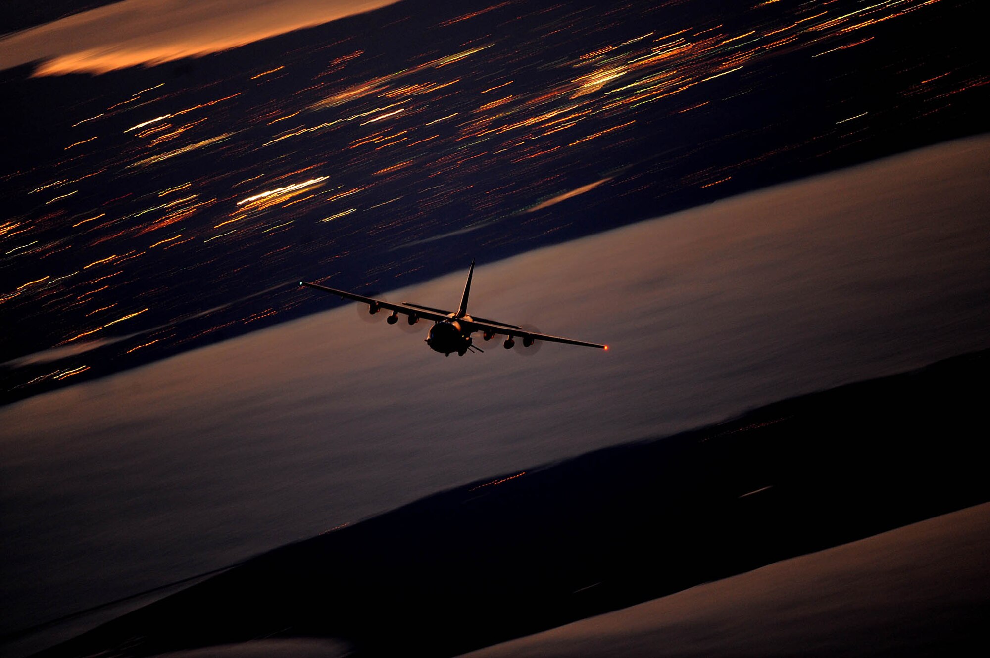 An AC-130U Gunship flies a local training mission Jan. 27, 2011, over Hurlburt Field, Fla. The Gunship is the primary weapon of Air Force Special Operations Command, and its primary missions are close-air support, air interdiction and armed reconnaissance. The Gunship is assigned to the 4th Special Operations Squadron at Hurlburt Field. (U.S. Air Force photo/Master Sgt. Jeremy T. Lock)