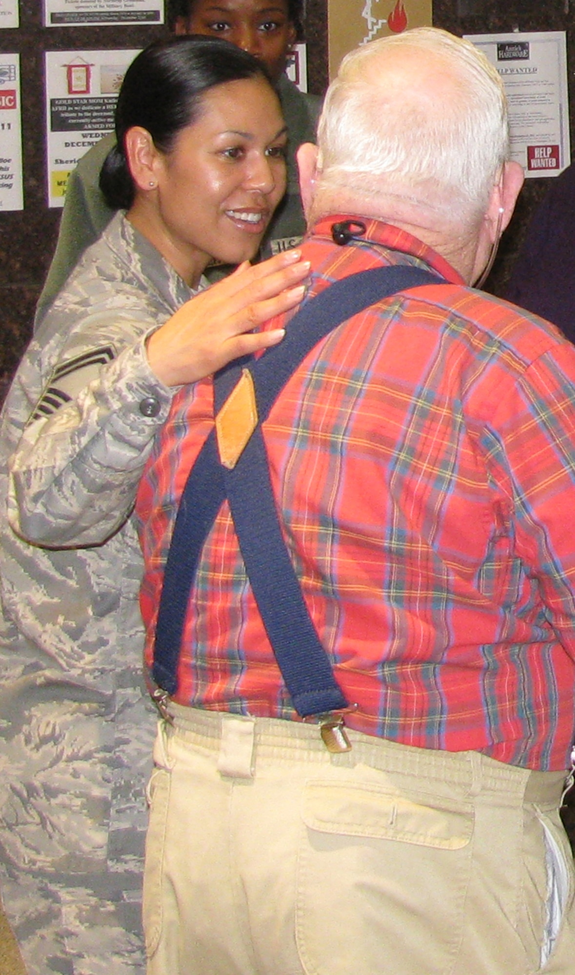 Special Agent Cynthia Gamez visits with one of the veterans at the Armed Forces Retirement Home. She was there as part of OSI's visit to the home Dec. 21. OSI sponsored a veterans angel tree program in the National Capital Region, collecting more than 100 gifts for the residents of the AFRH.  The gifts were presented at the Hero’s Tree dedication. OSI members from AFOSI Headquarters, Marine Corps Base Quantico, Va., and from all around the NCR joined the residents for lunch and shared some quality time together in celebration of the holiday season. (U.S. Air Force Photo)