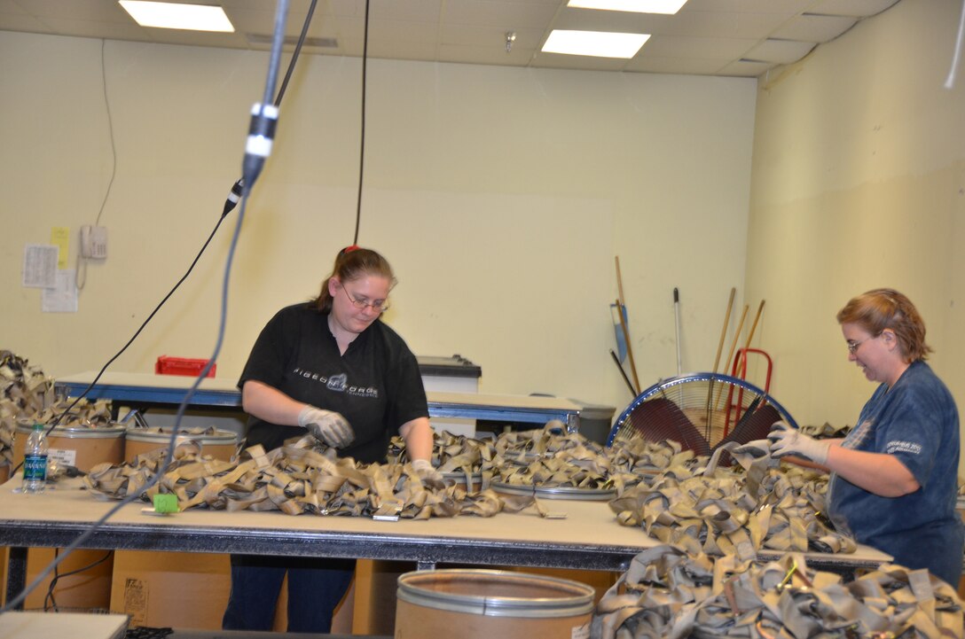 WRIGHT-PATTERSON AIR FORCE BASE, Ohio – From left to right, Allison Elliott and April Wells, TAC employees, sort cargo nets during the 445th Airlift Wing’s visit to TAC Enterprises Dec. 19. (U.S. Air Force photo/Lt. Col. Cynthia Harris)