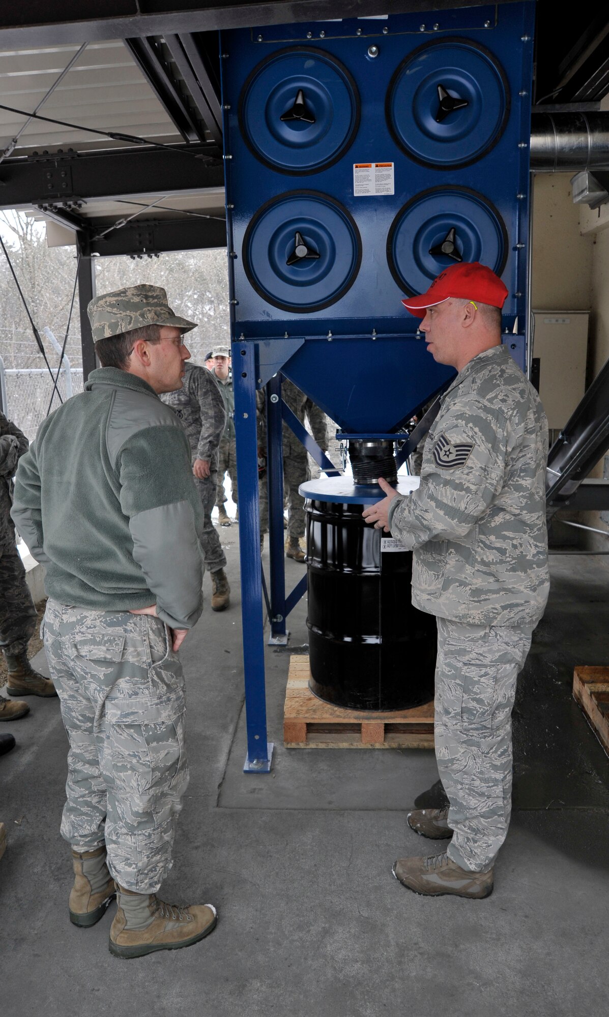 MISAWA AIR BASE, Japan -- Col. Michael Rothstein, left, 35th Fighter Wing commander, and Col. John Griffin, 35th Mission Support Group commander, participate in the ribbon cutting ceremony for the 35th Security Forces Squadron's Combat Arms Training and Maintenance Range reopening here Jan. 4. Instead of cutting through a ribbon with scissors, wing leadership shot a clay pigeon suspended by a ribbon in the repaired, indoor shooting facility. (U.S. Air Force photo/Staff Sgt. Nathan Lipscomb)