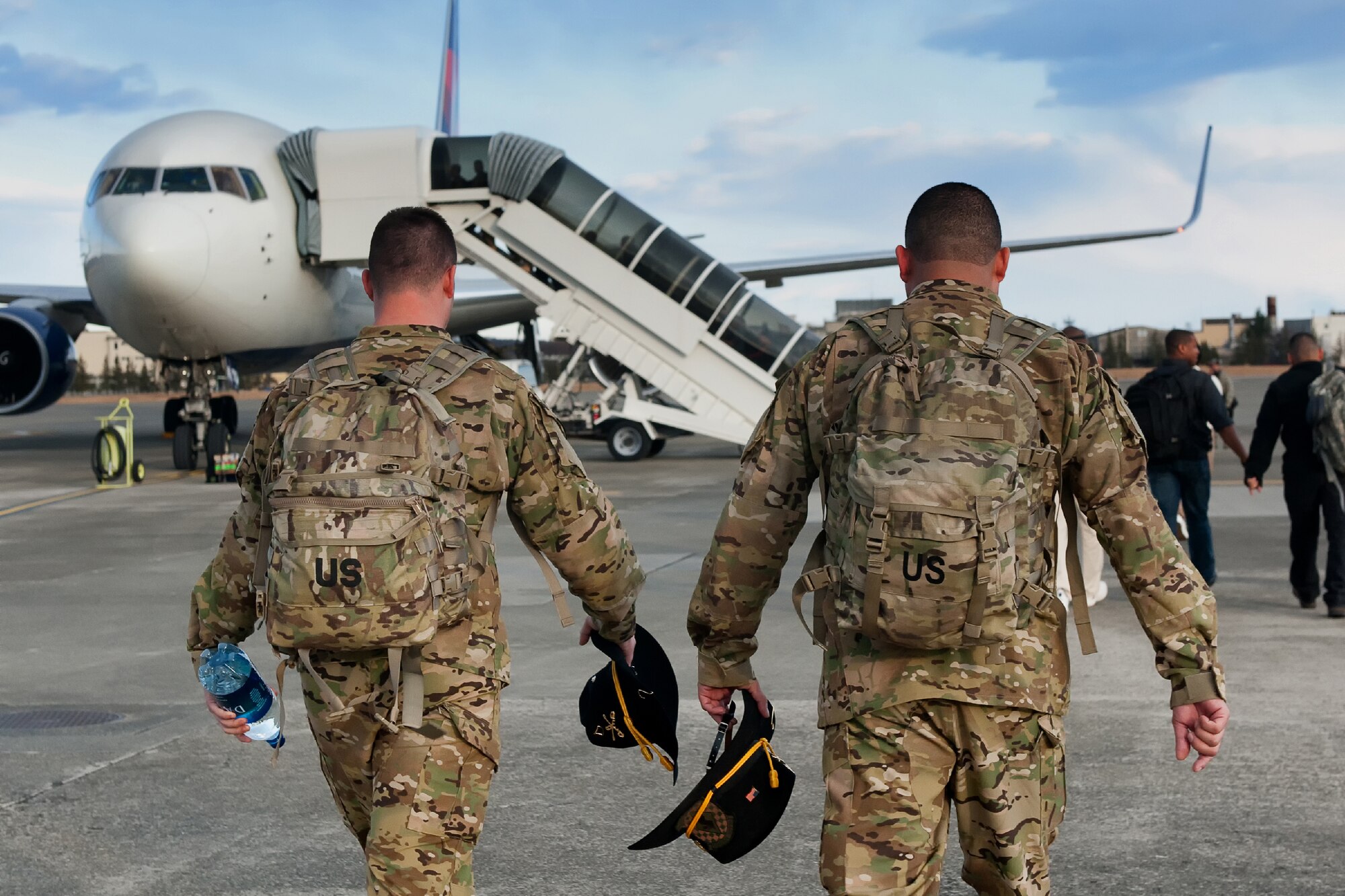 YOKOTA AIR BASE, Japan -- Soldiers from the 83rd Infantry Division, board a Boeing 737, at the Yokota passenger terminal, Jan. 4, 2011 to support a Joint Air Expeditionary Force mission, sponsored by the U.S. Transportation Command at Navy Support Facility Diego Garcia. (U.S. Air Force photo/Osakabe Yasuo)