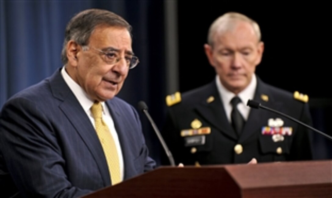 Defense Secretary Leon E. Panetta speaks to the press about the new defense strategy as Army Gen. Martin E. Dempsey, chairman of the Joint Chiefs of Staff, looks on at the Pentagon, Jan. 5, 2012.