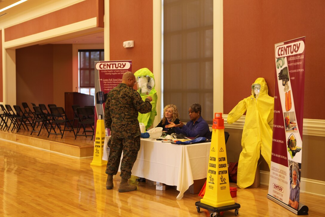 A service member speaks to a representative from a corporation at Marine Corps Installations East’s Safety Expo Jan. 6.  Patrons at the event were able to view demonstrations and ask questions of the representatives present. (Official U.S. Marine Corps Photo by Lance Cpl. Jackeline M. Perez Rivera)