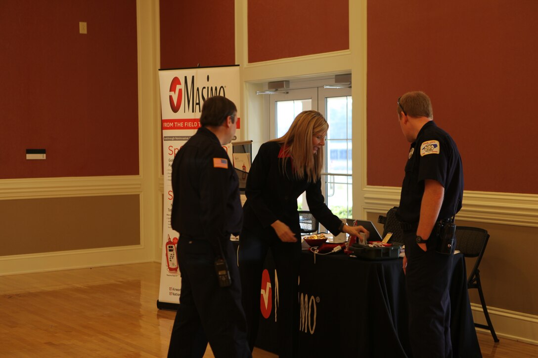 Participants speak to a representative from a corporation at Marine Corps Installations East’s Safety Expo Jan. 6.  The event was held to get people back into the mindset of safety after the holidays. (Official U.S. Marine Corps Photo by Lance Cpl. Jackeline M. Perez Rivera)