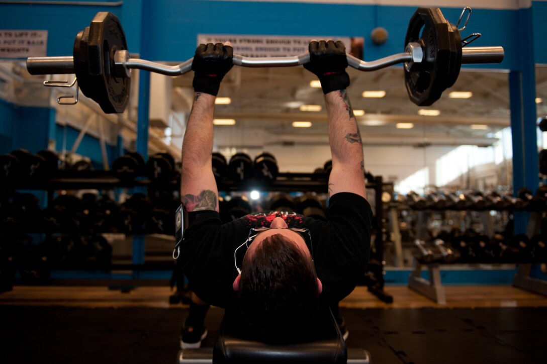 Staff Sgt. James Noblin, 28th Logistics Readiness Squadron NCO in charge of licensing, lifts weights in the Bellamy Fitness Center on Ellsworth Air Force Base, S.D., Jan. 5, 2012. The weight room is one of several fitness amenities available to the base community at Ellsworth’s award-winning fitness center. (U.S. Air Force photo by Airman 1st Class Kate Thornton/Released)