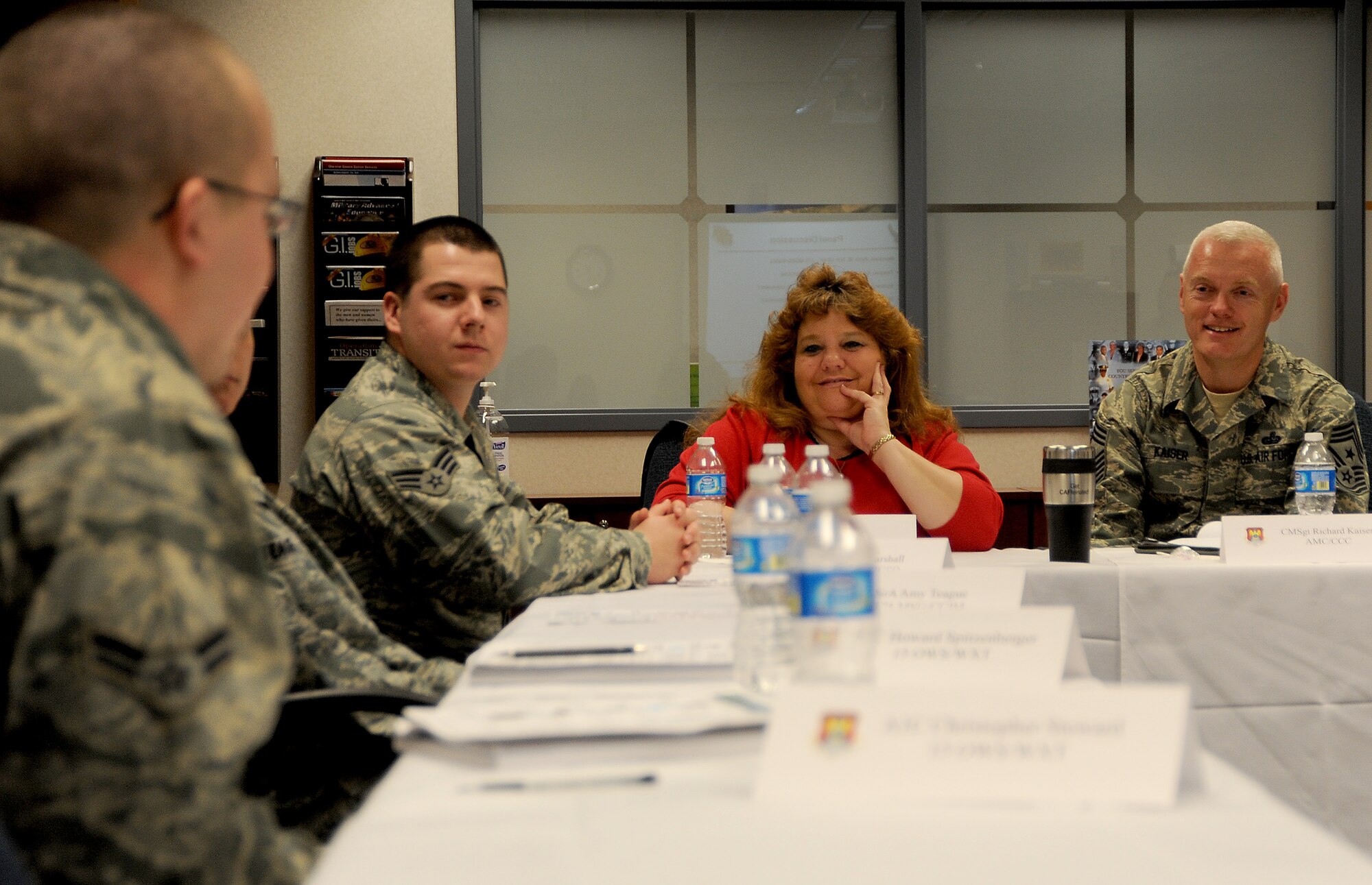 Chief Master Sgt. Richard Kaiser, Air Mobility Command command chief, and Mrs. Kaiser speak with Airmen during a resiliency briefing Jan. 6, 2012 at Scott Air Force Base, Ill.  Kaiser recieved feedback from the Airmen on how resiliency training impacted their lives. (U.S. Air Force photo/ Airman 1st Class Divine Cox) 