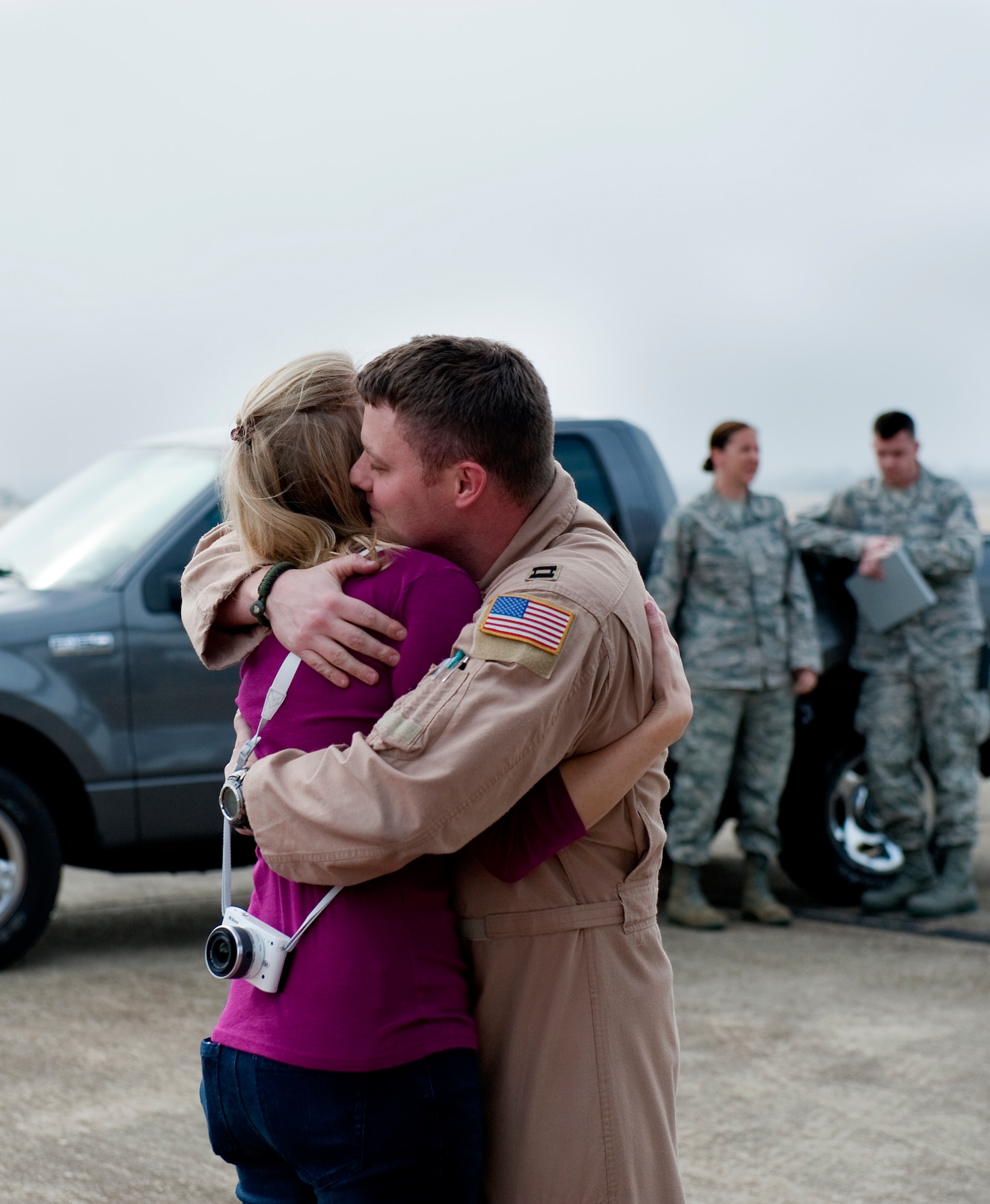 U.S. Air Force Capt. Andy Rhodes, navigator for 9th Special Operations Squadron, hugs his wife, Tina, after returning from deployment in Iraq on Eglin Air Force Base, Fla., Jan. 6, 2012. Airmen from the 9th SOS have been deployed in support of Operations Iraqi Freedom and New Dawn since March 2003. (U.S. Air Force photo/Airman 1st Class Christopher Williams)(Released)