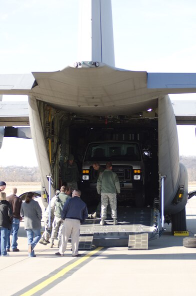 Members of the 139th Airlift Wing secure a vehicle from the Federal Emergency Management Agency onto a C-130 Herculres at Rosecrans Air National Guard Base, St. Joseph, Mo., Jan. 6, 2012. Members of FEMA region 7 observed the loading of two vehicles in preparation for an exercise later this month. (Missouri Air National Guard photo by Staff Sgt. Michael Crane)