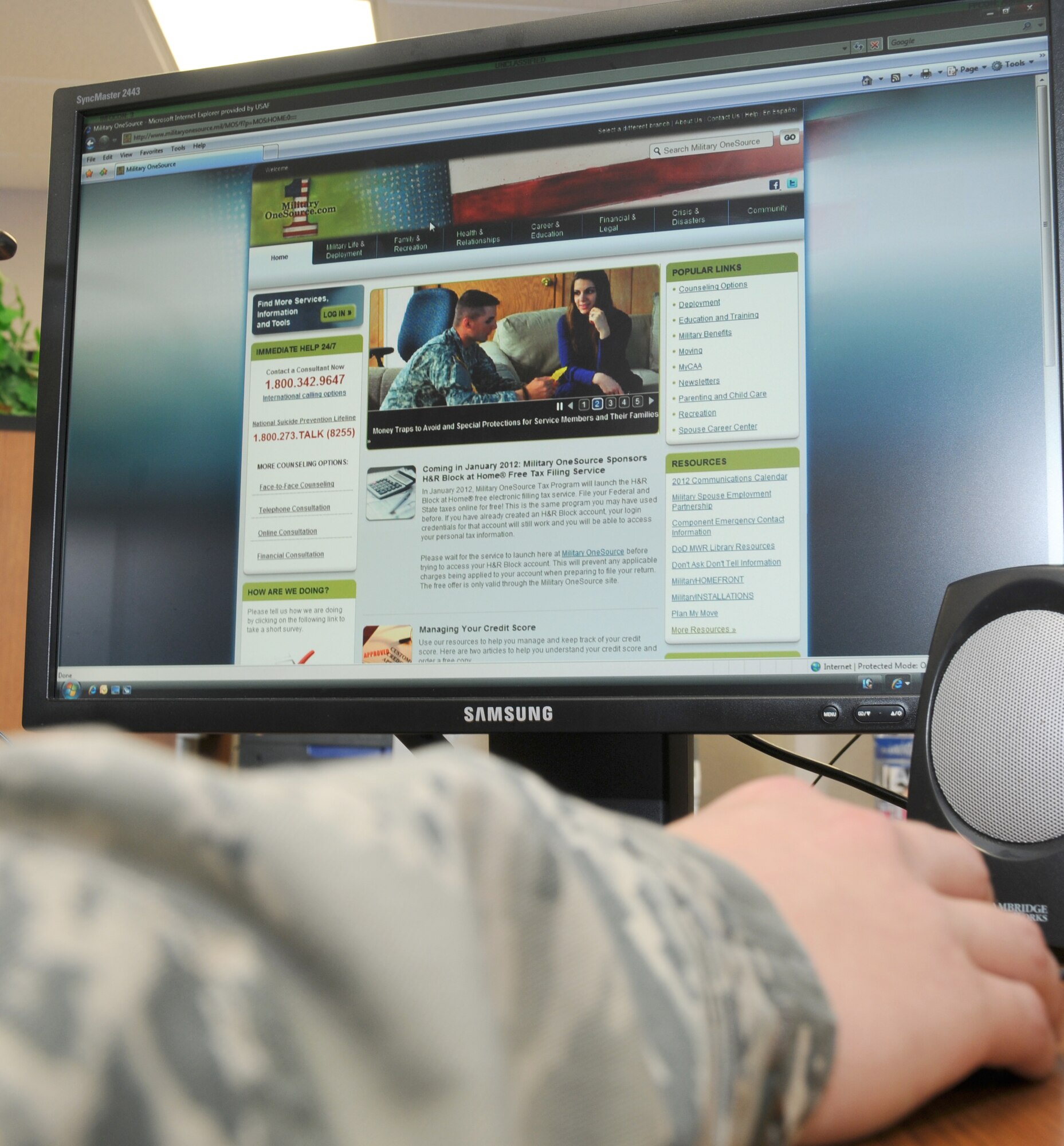 A service member views Military OneSource’s web site, www.militaryonesource.com    Military OneSource is a venue to provide help with a broad range of concerns including money management, spouse employment and education, parenting and child care, relocation, deployment, reunion, and the particular concerns of families with special-needs members. Services are available 24 hours a day by online and by telephone at 1-800-342-9647.  (U.S. Air Force photo by Kemberly Groue)