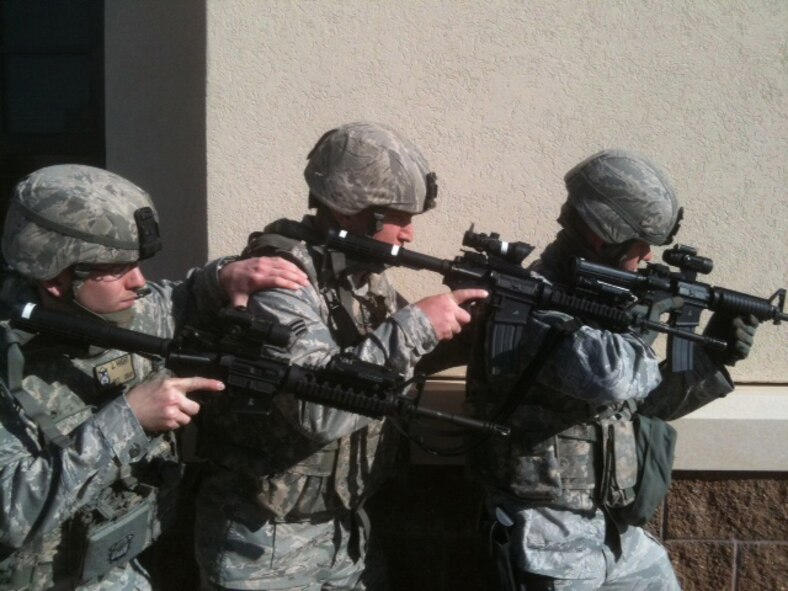Barksdale Emergency Services Team Leader, 2nd Lt. Joshua Hight, Left, Senior Airman Chace Northcutt, middle, and Airman 1st Class Tony Theisen, stack-up against a wall before enterting a building during an exercise on Barksdale Air Force Base, La., Jan. 2. The EST, similar to a Special Weapons and Tactics team, trains regularly in order to effectively respond to a variety of emergencies when called upon, such as armed attacks, crowd control, vehicle assaults and hostage scenarios. (Courtesy Photo)(RELEASED)
