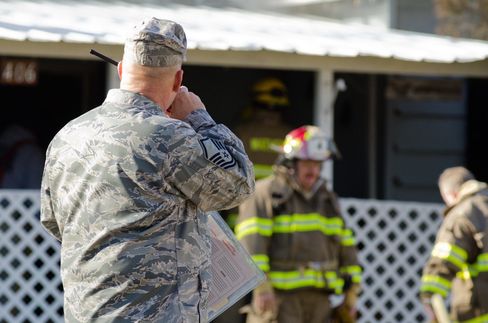 Master Sgt. Mark Geeting, 139th Fire Department, communicates with local emergency responders via radio in Elwood, Kan., Jan. 5, 2012. Airmen from Rosecrans Air Guard Base, St. Joseph, Mo., assisted local fire departments with a residential fire. (Missouri Air National Guard photo by Staff Sgt. Michael Crane)