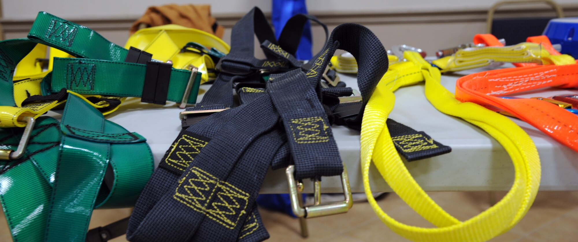 Multiple types of safety harnesses sit on display at a Safety Fair on Barksdale Air Force Base, La., Jan. 3. Their are a few different types of harnesses with their own unique properties; some are nearly indestructible because they are woven from Kevlar fibers, and others have a special coating that renders them invulnerable to damage from chemical substances. (U.S. Air Force photo/AIrman 1st Class Andrew Moua)(RELEASED)