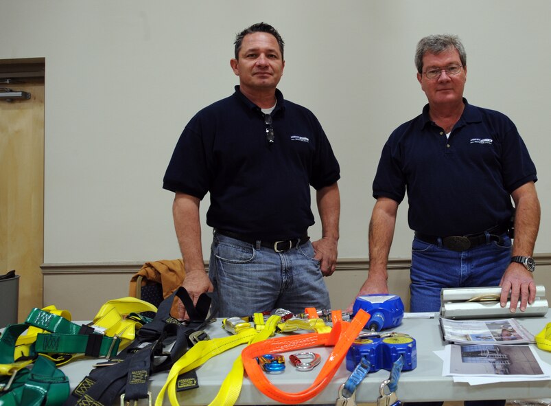 Tony Gordoa and John Lingner, employees of Webb-Rite Safety Inc. attend a Safety Fair on Barksdale Air Force base, La., Jan. 3. The company specializes in fall protection with many types of harnesses and winches to help protect someone should they fall off a roof or other high area. (U.S. Air Force photo/Airman 1st Class Andrew Moua)(RELEASED)