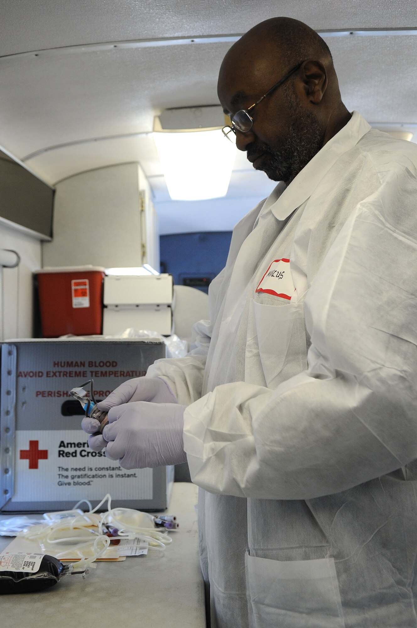 American Red Cross employee Marcus Raven organizes donations at the blood drive at Shaw Air Force Base, S.C., Jan. 5, 2011. Shaw’s 20th Contracting Squadron and  20th Logistics Readiness Squadron directed and sponsored the event. (U.S. Air Force photo by Airman 1st Class Hunter Brady/Released)