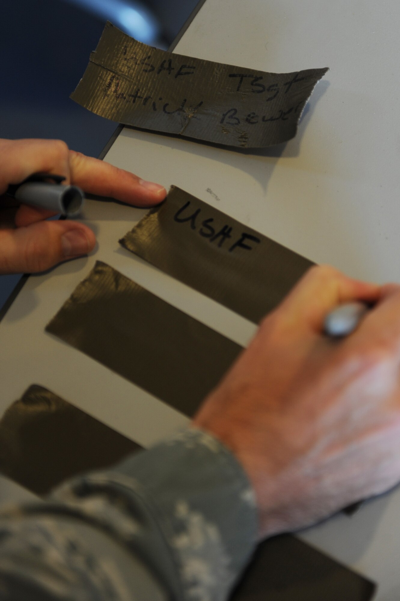 U.S. Air Force Tech. Sgt. Patrick Brewer, 23rd Force Support Squadron, creates identification tapes during ability to survive and operate training at Moody Air Force Base, Ga., Jan. 5, 2012. ATSO training gives Airmen skills to successfully complete  the upcoming operational readiness exercise. (U.S. Air Force photo  by Staff Sgt. Ciara Wymbs/Released) 