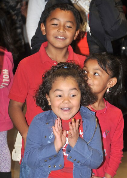 Children of all ages got excited to see Santa Claus as local families participated in “Operation Holiday Cheer” Dec. 20 at Kirtland Air Force Base’s Fire Station No. 2. The event included a meal, a visit from Santa, arts and crafts and displays from the ABQ BioPark.  U.S. air Force Photo by Todd Berenger
