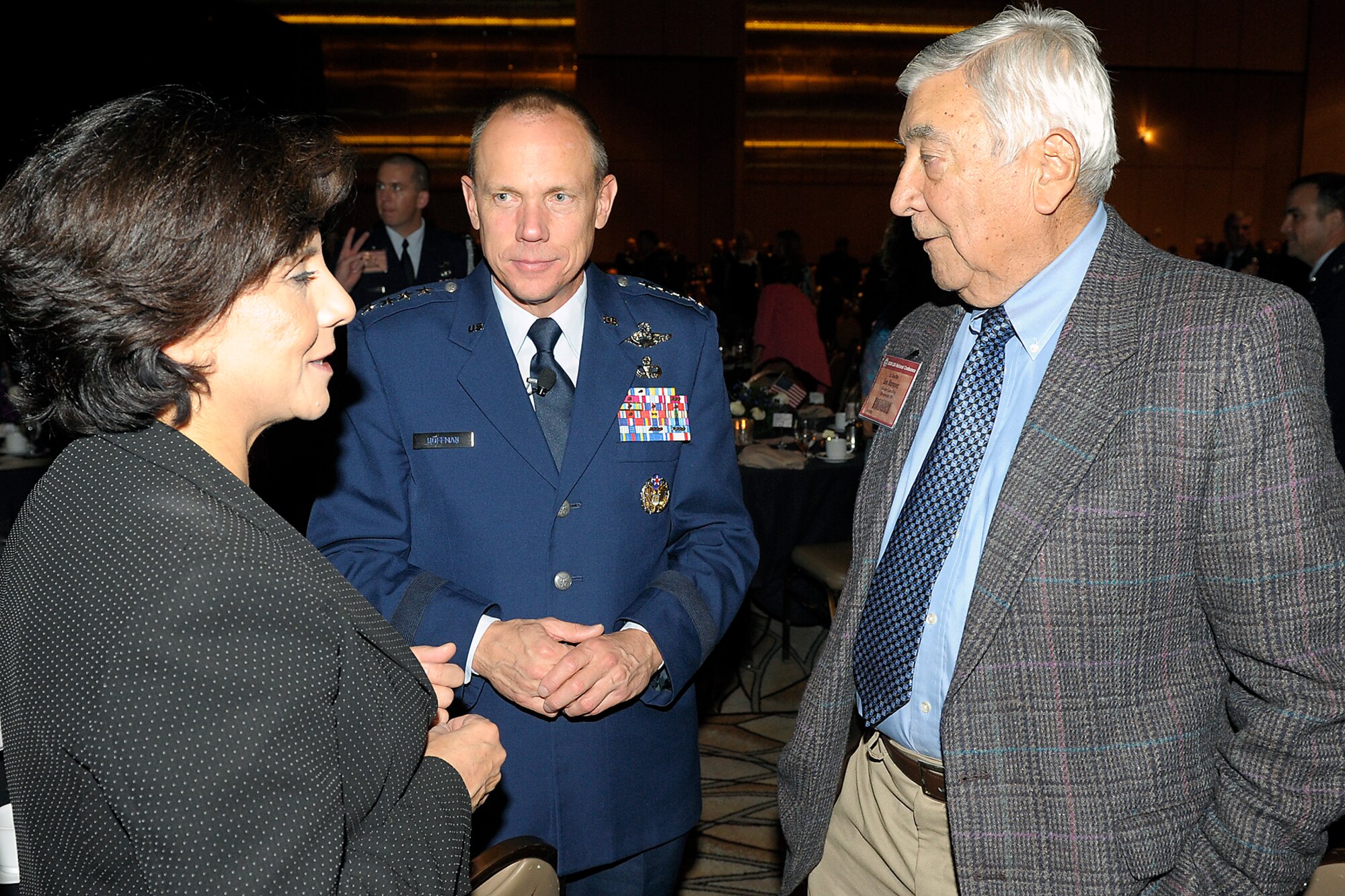 Retired Lt. Gen. Leo Marquez, right, and his daughter, Patricia Knighten, speak with Gen. Donald Hoffman, Air Force Materiel Command commander, at the 2009 Logistics Officer Association conference. 