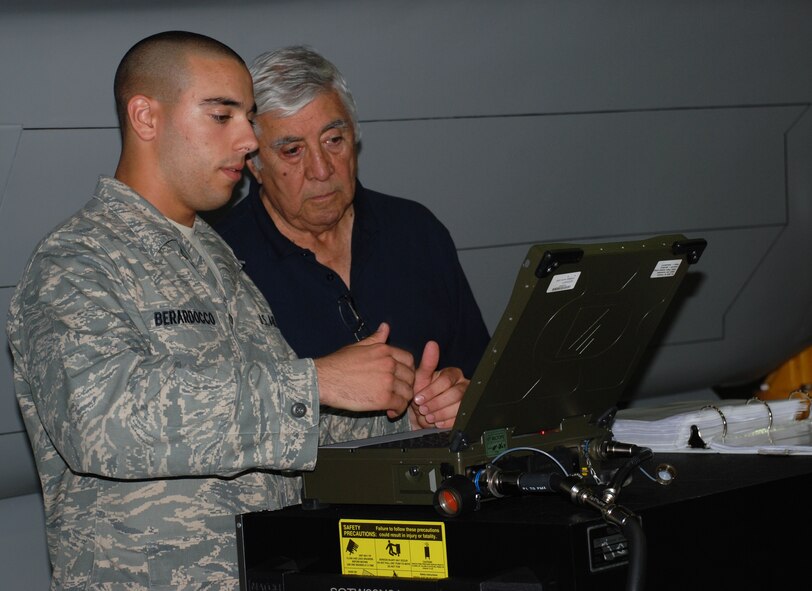 Airman Anthony Barardocco, a student from the 363rd Training Squadron, shows retired Lt. Gen. Leo Marquez, the former deputy chief of staff for logistics and engineering, some of his F-22 Raptor armament training.