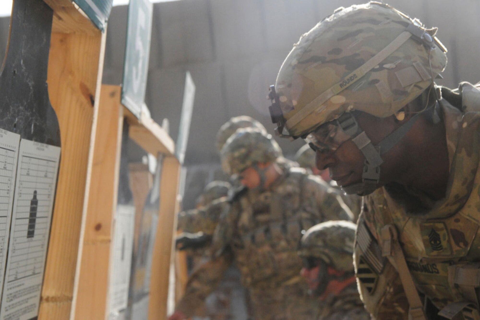 Sgt. Maj. Connie Rounds, a Soldier with the 4th Brigade Combat Team (Airborne), 25th Infantry Division, Task Force Spartan, confirms his sight adjustment after firing his weapon at Bagram Dec. 17. Rounds and the rest of Task Force Spartan assumed responsibility last week as part of Regional Command-East. (U.S. Army photo/Staff Sgt. Jason Epperson)