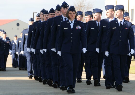 More than 100 new active duty and guard officers were commissioned and began officer careers Dec. 16 after graduating in the first combined Basic Officer Training and Academy of Military Sciences graduation ceremony and parade, which reflects a joint team, joint fight concept, according to 1st Lt. Karl Wiest, flight commander, 24th Training Squadron. Basic Officer Training trains and commissions second lieutenants to fulfill Air Force active-duty and Air Force Reserve requirements in partnership with the U.S. Air Force Academy and Air Force Reserve Officer Training Corps. The program consists of 12 weeks of military instruction and leadership development for college graduates leading to a commission as a second lieutenant. The Academy of Military Science, a detachment of the Air National Guard Readiness Center, is a six-week program designed to train and commission second lieutenants to fulfill Air National Guard requirements. AMS was established in 1971 and has commissioned more than 14,500 officers. Originally located at McGhee-Tyson Air National Guard Base in Knoxville, Tenn., AMS relocated to Maxwell in 2009. To commission as officers, all OTS trainees complete a demanding accessions program. In addition, they also volunteered hundreds of hours of local community service, including participating in blood drives, supporting the Montgomery Veterans Day parade and helping build houses in support of Habitat for Humanity. (Air Force Photo/Bud Hancock)