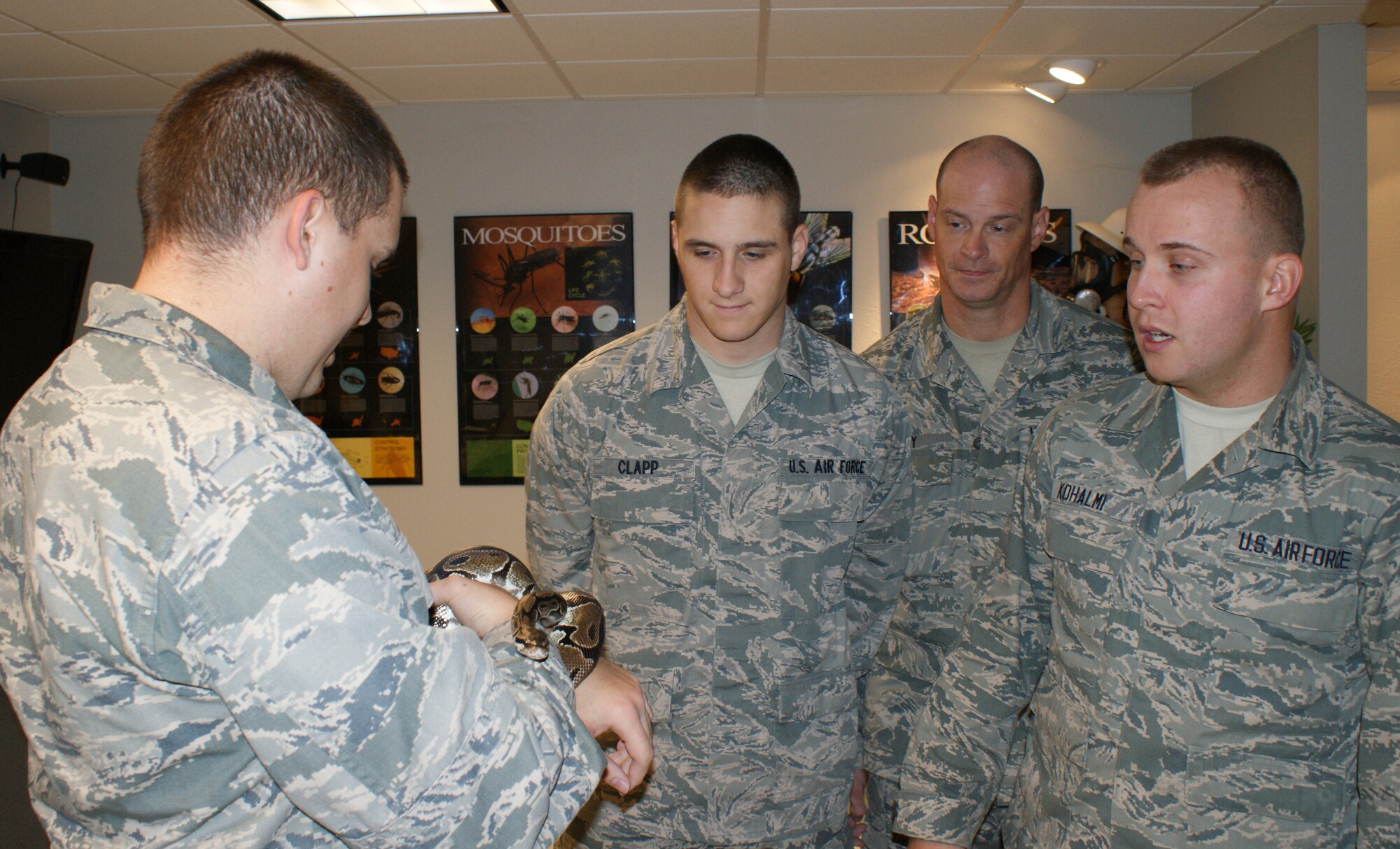 Airman 1st Class Kevin Carey learns how to handle animals, including snakes, Dec. 16, 2011 while attending the Pest Management Apprentice course conducted by the 366 Training Squadron at Sheppard Air Force Base, Texas.  Airmen Carey joined the Air National Guard in 2011 at age 39 after spending 18 years as a civilian police officer. (U.S. Air Force photo/Dan Hawkins)