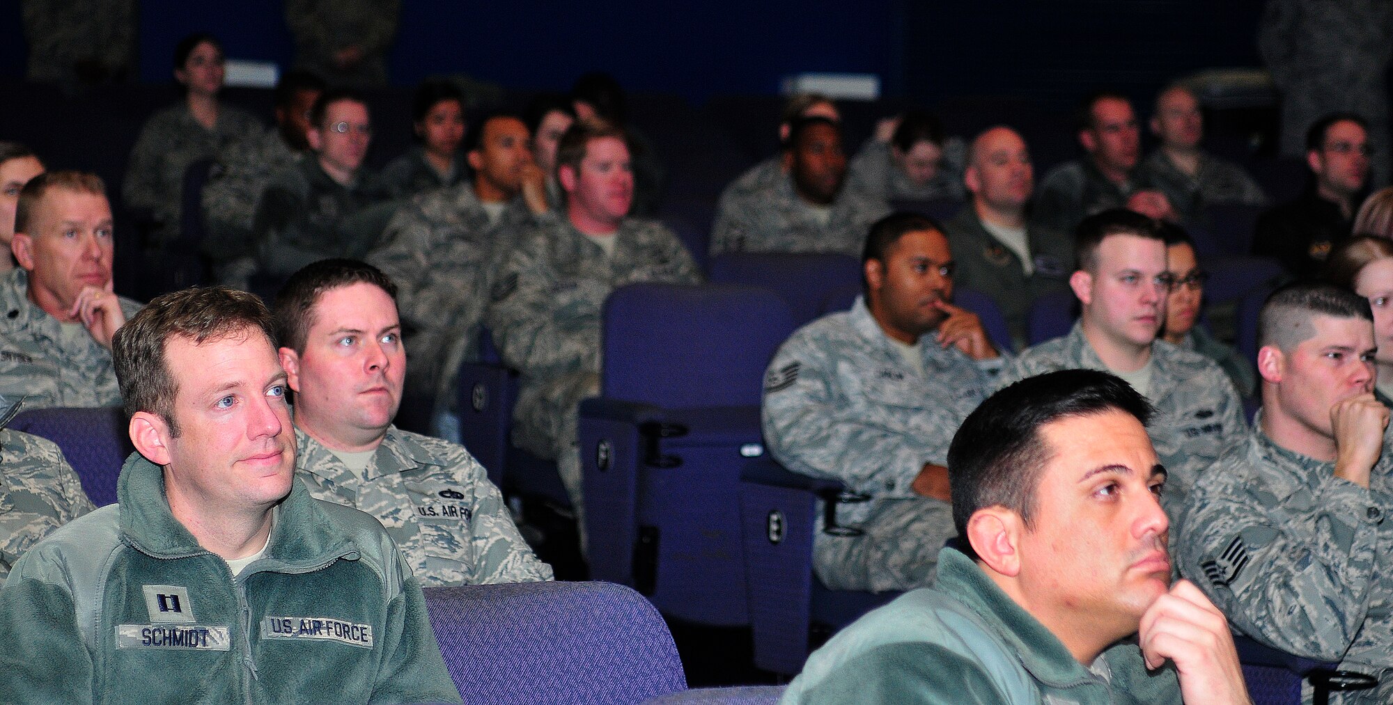 ROYAL AIR FORCE LAKENHEATH, England - Airmen listen as Col. John Quintas, 48th Fighter Wing commander, speaks during a commander's call for the Wing Staff Agency to recap 2011 at the base theater, Jan. 3, 2012. Quintas hosted commander?s calls for all groups throughout the base to kick off Wingman Day, express his thoughts on 2011 and explain his expectations for 2012. Wingman Day is about encouraging Airmen to work together as a team and to be there for their fellow Airmen. (U.S. Air Force photo by Senior Airman Tiffany M. Deuel)