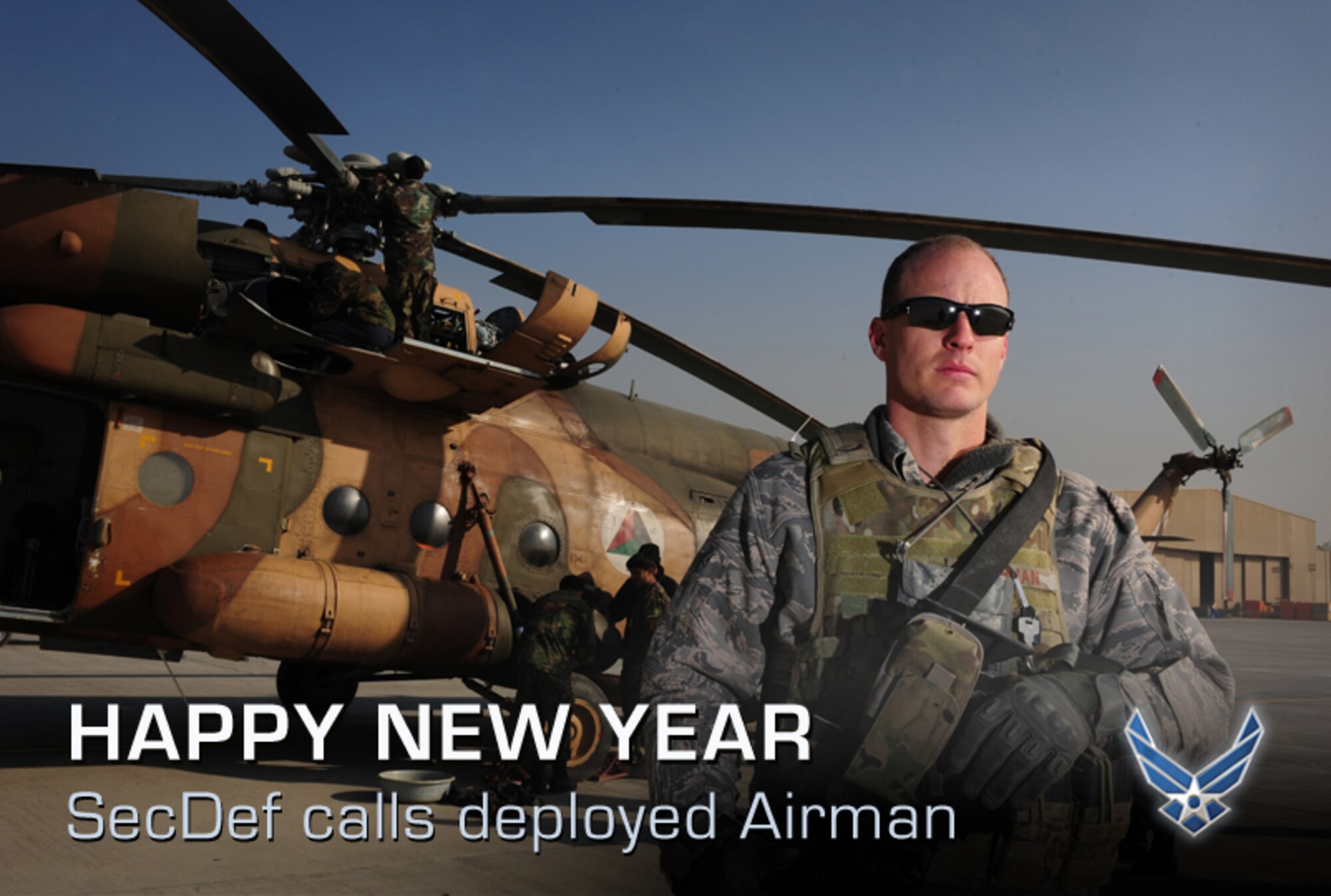 Tech. Sgt. Charles Heathman, an adviser with the 438th Air Expeditionary Wing , stands near an Afghan air force MI17 prior to receiving a phone call from Secretary of Defense Leon Panetta New Year's Day, Jan. 1, 2012, at Kabul International Airport. Heathman was hand-picked as the Air Force representative to receive a call from Panetta. (U.S. Air Force photo by Staff Sgt. Nadine Y. Barclay)