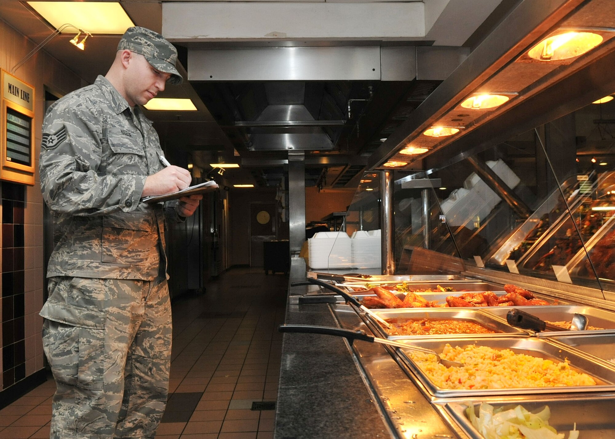 RAF MILDENHALL, England - Staff Sgt. Jared Weese, 100th Force Support Squadron, documents food temperatures at the Gateway Dining Facility here Jan. 4, 2012. The dining facility garnered the 2011 USAFE Food Service Excellence Award for the Single- Facility category. They also won the award in 2010. (U.S. Air Force photo/Senior Airman Jerilyn Quintanilla) 