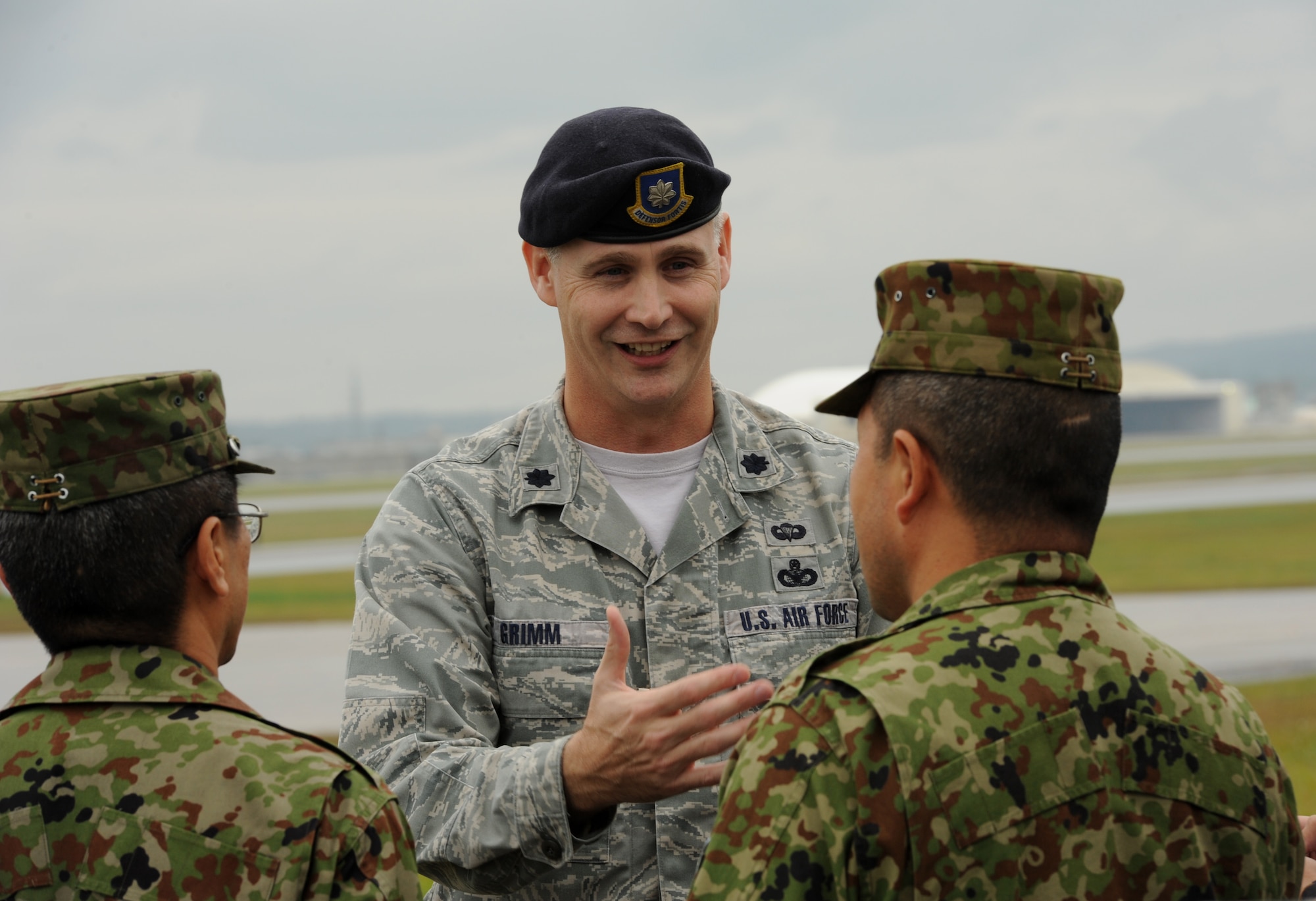 U.S. Air Force Lt. Col. John Grimm, 18th Security Forces Squadron commander, speaks with members of the 15 Brigade, Japan Ground Self Defense Force during their site visit to Kadena Air Base, Japan, Jan. 6, 2012. During their visit, JGSDF members received a mission orientation briefing from Lt. Col. Grimm as well as a tour of the base to promote bilateral exchange between U.S. and Japanese forces. (U.S. Air Force photo by Senior Airman Jarvie Z. Wallace)
