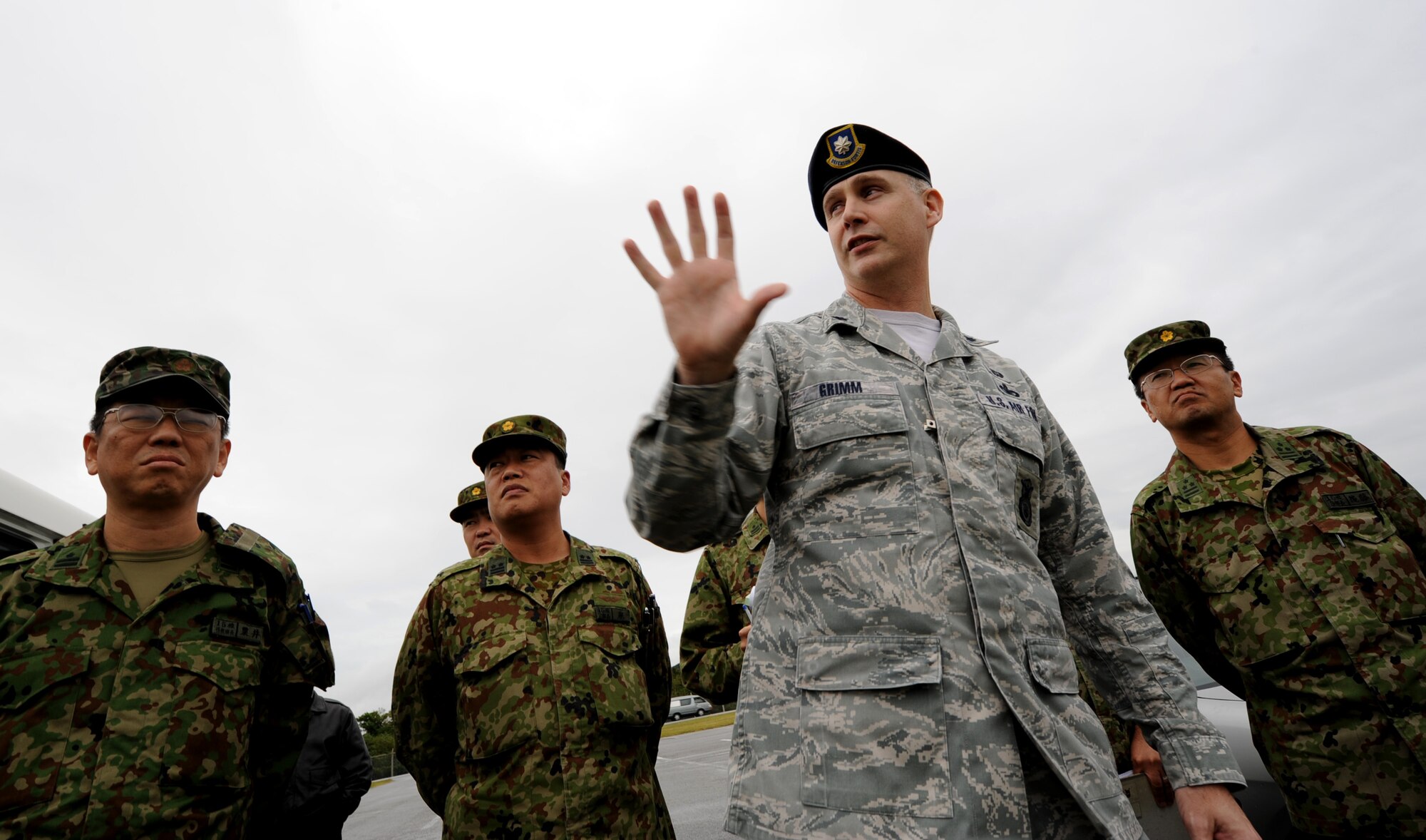 U.S. Air Force Lt. Col. John Grimm, 18th Security Forces Squadron commander, briefs members of the 15 Brigade, Japan Ground Self Defense Force during their site visit to Kadena Air Base, Japan, Jan. 6, 2012. During their visit, JGSDF members received a mission orientation briefing from Lt. Col. Grimm as well as a tour of the base to promote bilateral exchange between U.S. and Japanese forces. (U.S. Air Force photo by Senior Airman Jarvie Z. Wallace)
