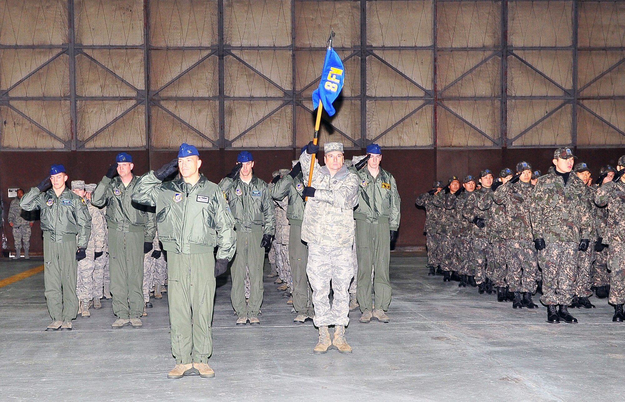 Members of the 8th Fighter Wing render a final salute to Lt. Gen. Jeffrey Remington, former 7th Air Force commander, during a change of command ceremony at Osan Air Base, Republic of Korea, Jan. 6, 2012.  Remington retires after nearly 35 years of active duty service. (U.S. Air Force photo/ Staff Sgt. Daylena Gonzalez)