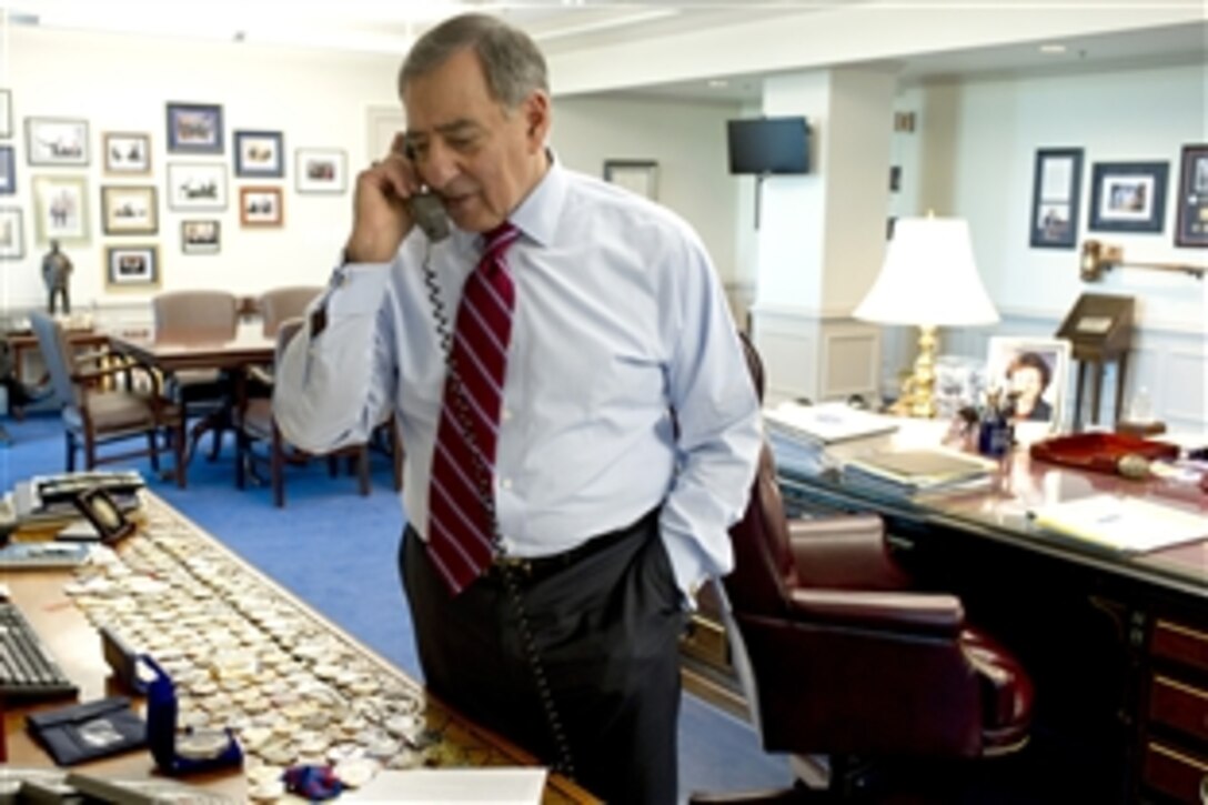 Defense Secretary Leon E. Panetta speaks to Navy Rear Adm. Craig S. Faller, commander of  Strike Group 3, while in his office at the Pentagon, Jan. 6, 2012. Panetta congratulated him and the U.S. Navy personnel who safely rescued Iranian sailors in the northern Arabian Sea. The Iranian sailors had been held hostage by pirates.