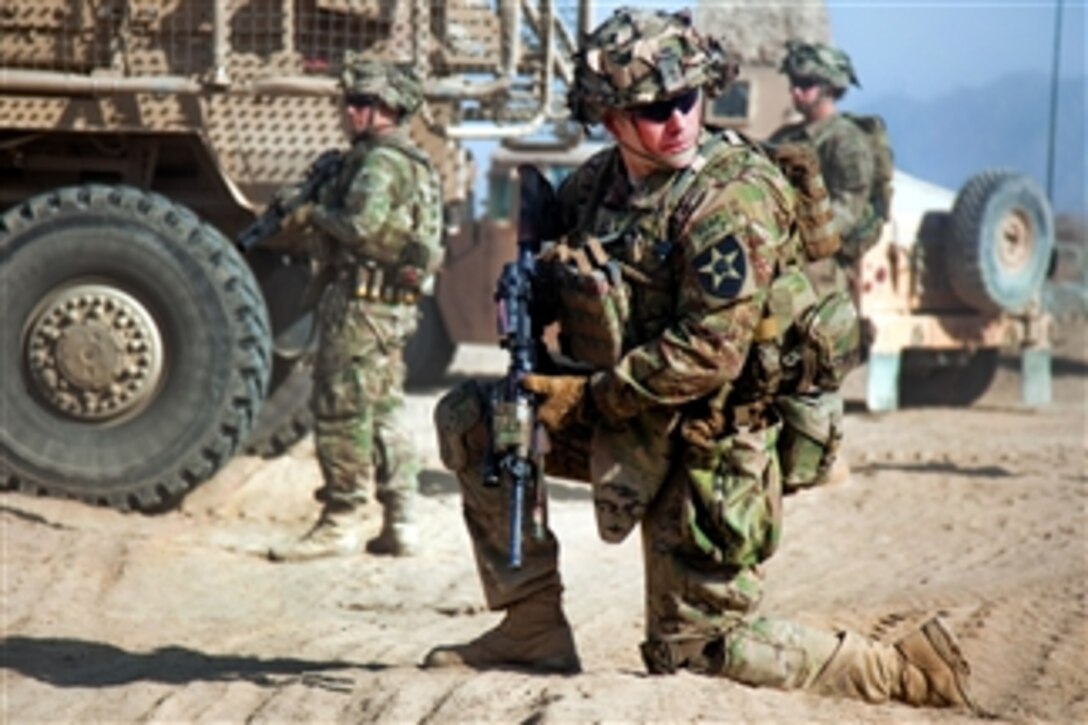 A U.S. Army soldier provides security outside Mullayan in Afghanistan's Kandahar province on Dec. 26, 2011.  The soldier is assigned to the 2nd Infantry Division's 5th Battalion, 20th Infantry Regiment.  