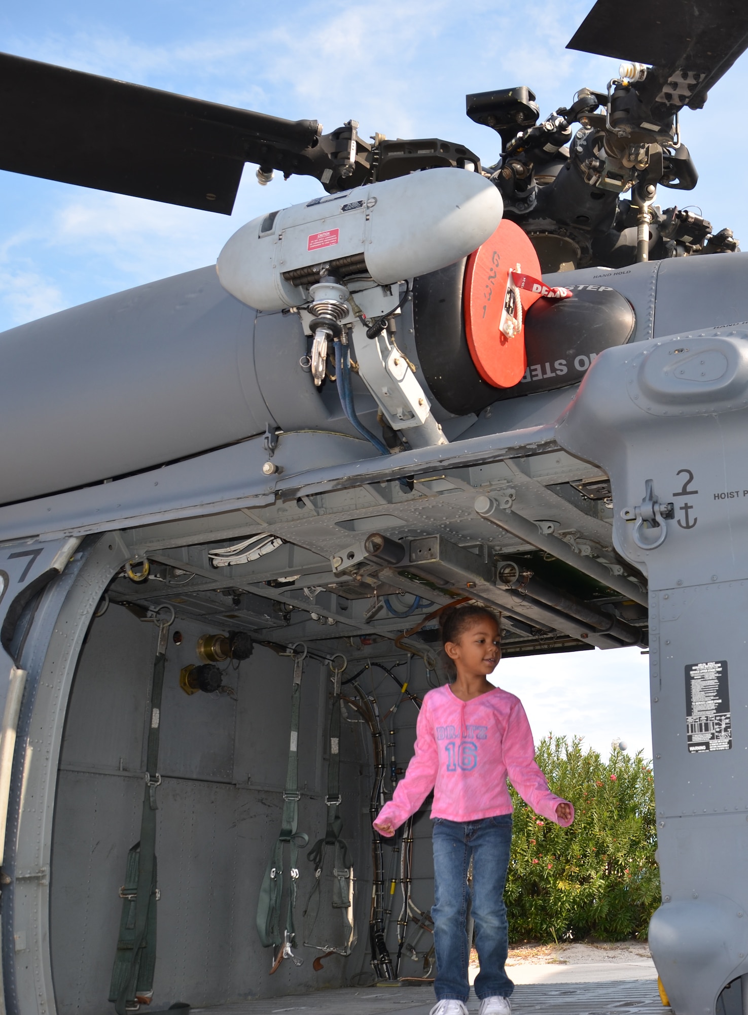 A child explores one of the 920th Rescue Wing's HH-60 Pave Hawk helicopters on display at Patrick Air Force Base, Fla., Jan. 7, 2012. Approximately 90 children of active duty and Reserve Airmen stationed at Patrick toured the aircraft as part of the Kids Understanding Deployments--also known as KUDOS--event on base. (U.S. Air Force photo/Staff Sgt. Anna-Marie Wyant)