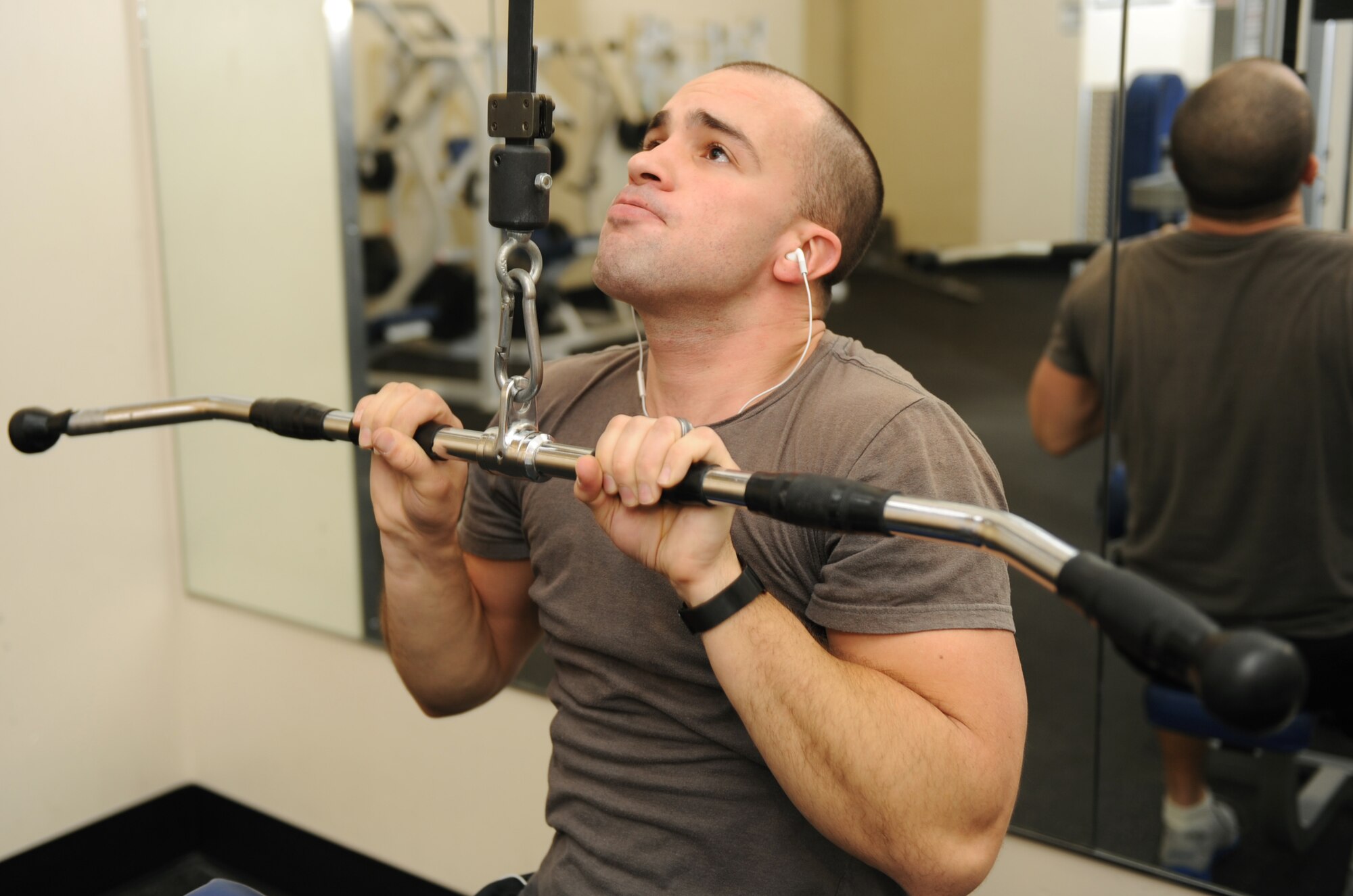 Senior Airman Blaze West, 366th Communications Squadron cyber transport technician, uses a weight resistance machine during an afternoon workout at the fitness center Jan. 6, 2012, at Mountain Home Air Force Base, Idaho. West works out to ensure he is physically fit to fight. (U.S. Air Force photo by Airman 1st Class Jonathan Glanville)