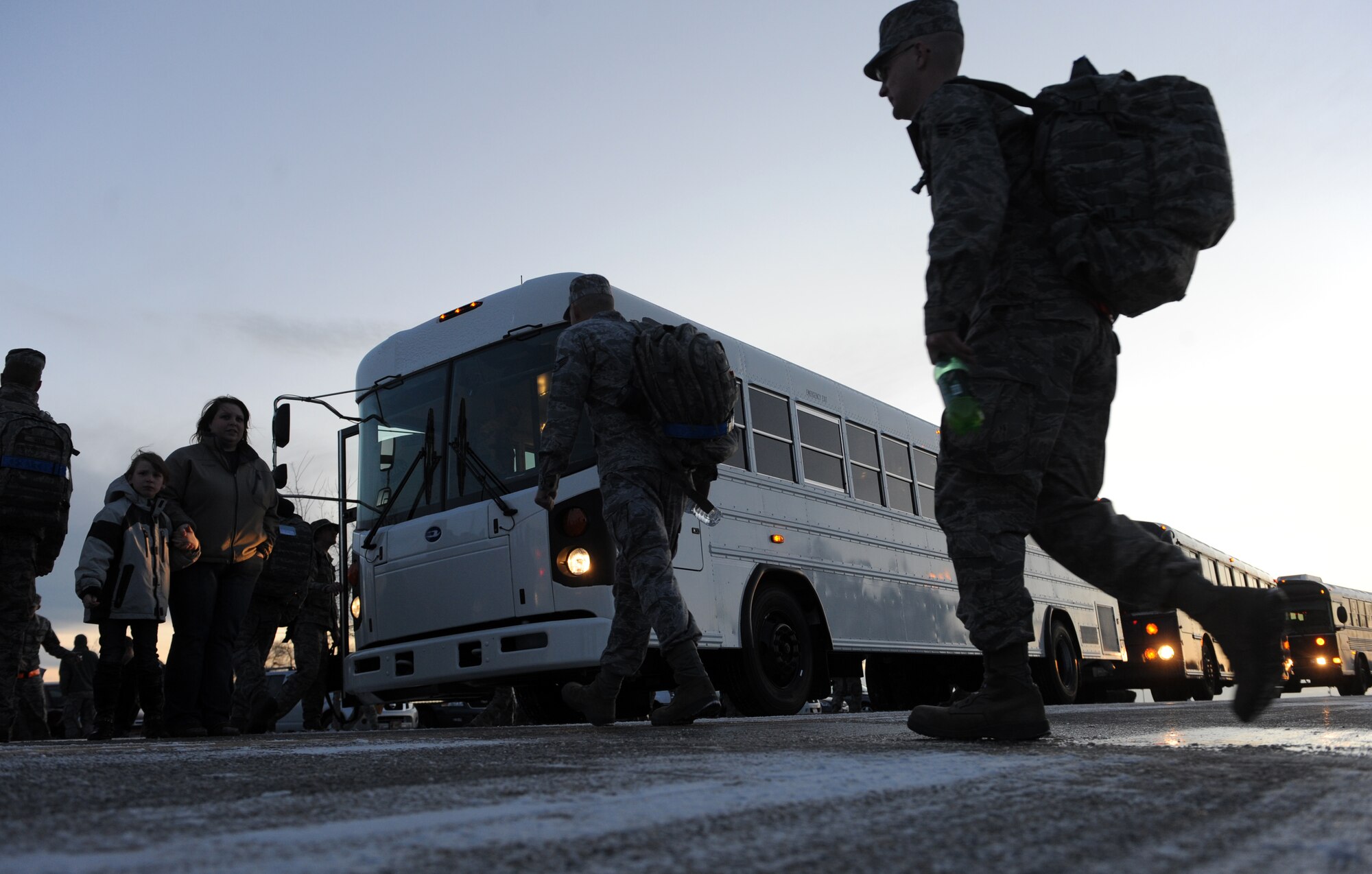 Airmen assigned to the 726th Air Control Squadron prepare to load up busses before leaving for deployment Jan. 7, 2012, at Mountain Home Air Force Base, Idaho. The 726th ACS continuously trains throughout the year to ensure the squadron is combat ready. In September 2011, the unit practiced their war fighting skills during multiple field exercises and convoy training to meet deployment requirements for in-theater command and control. (U.S. Air Force photo by Senior Airman Debbie Lockhart)