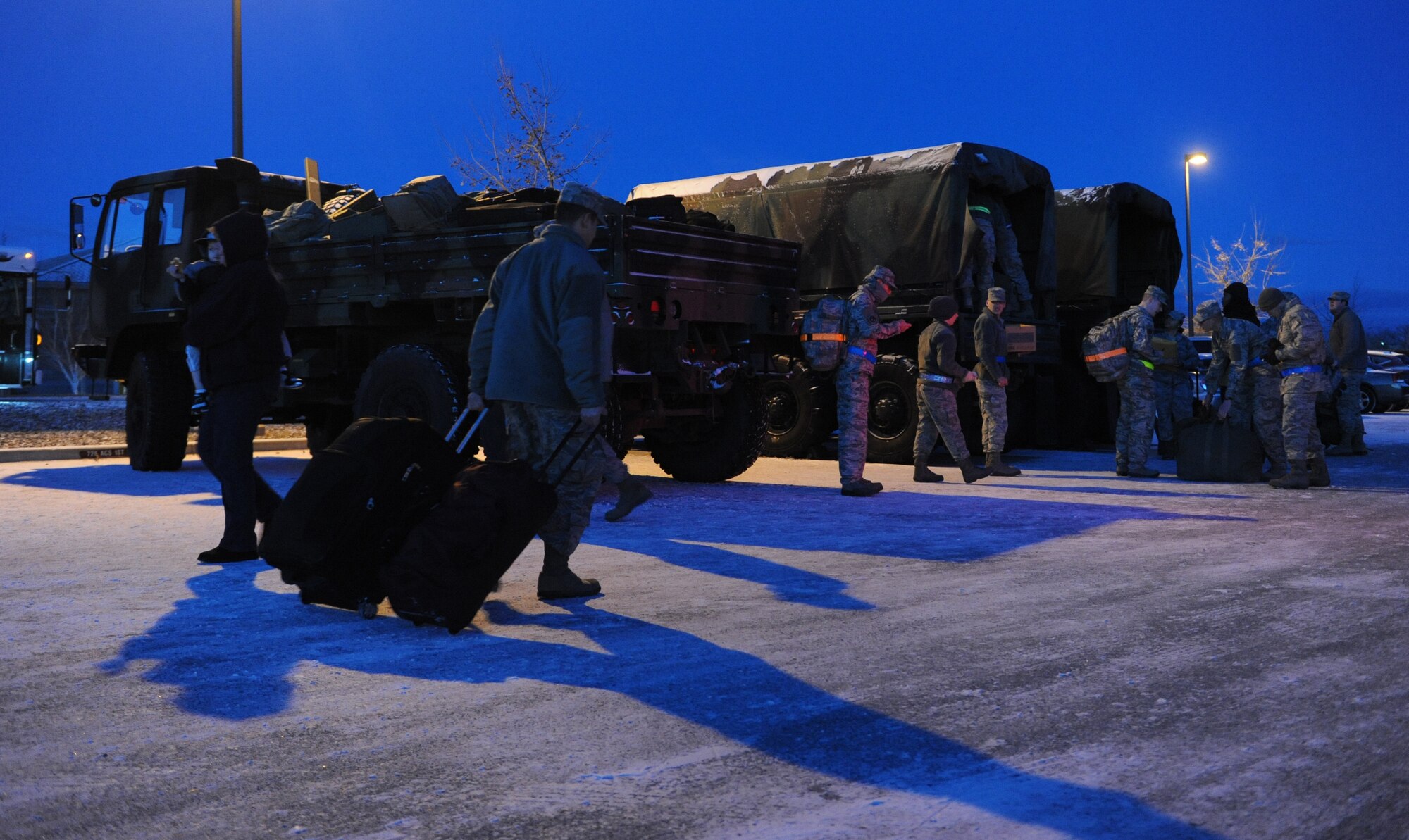 Airmen assigned to the 726th Air Control Squadron load luggage into trucks Jan. 7, 2012, at Mountain Home Air Force Base, Idaho, before leaving on deployment. More than 200 personnel from the 726th Air Control Squadron and sister units deployed to Southwest Asia in support of Operation Enduring Freedom. (U.S. Air Force photo by Senior Airman Debbie Lockhart)