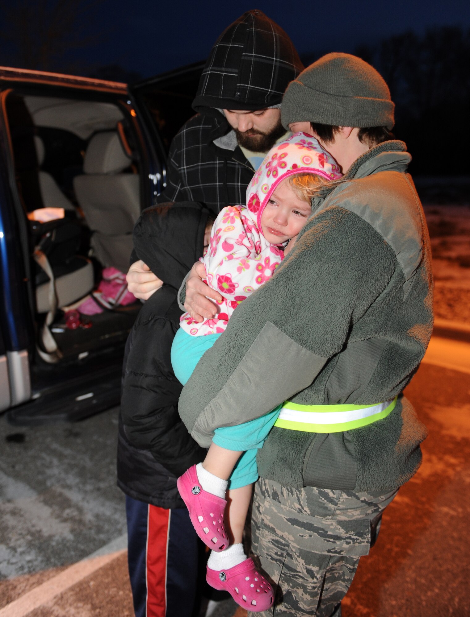 Staff Sgt. Crystal Monday, 726th Air Control Squadron weapons director, hugs her family goodbye before leaving on deployment Jan. 7, 2012, at Mountain Home Air Force Base, Idaho.  The 726th ACS has been deploying over half of the squadron to Southwest Asia since 2003 in support of air control operations and direct combat support. (U.S. Air Force photo by Senior Airman Debbie Lockhart)