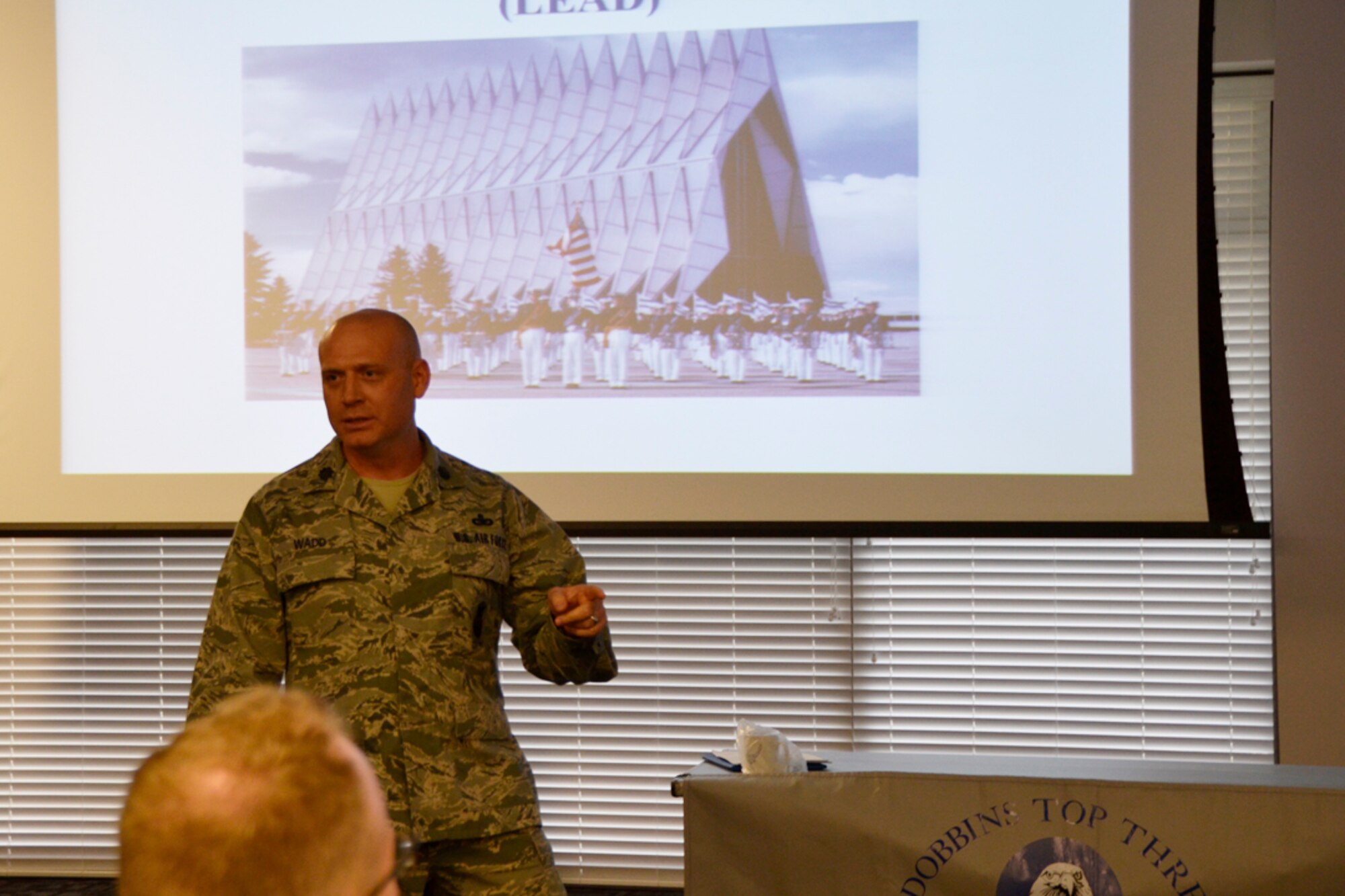 Lt. Col. Matthew Wadd, 22nd Air Force chief of security forces and Air Force Academy admission officer, introduced a 10-month enlisted-to-officer preparatory school offered by the academy to the Top Three members Dec. 4. “Senior noncommissioned officers know their junior enlisted, that’s why they’re the best recruiters for this program,” said Wadd. “Enlisted Airmen are good leaders because of their experience, background and diversity.” (U.S. Air force photo/Master Sgt. James Branch)