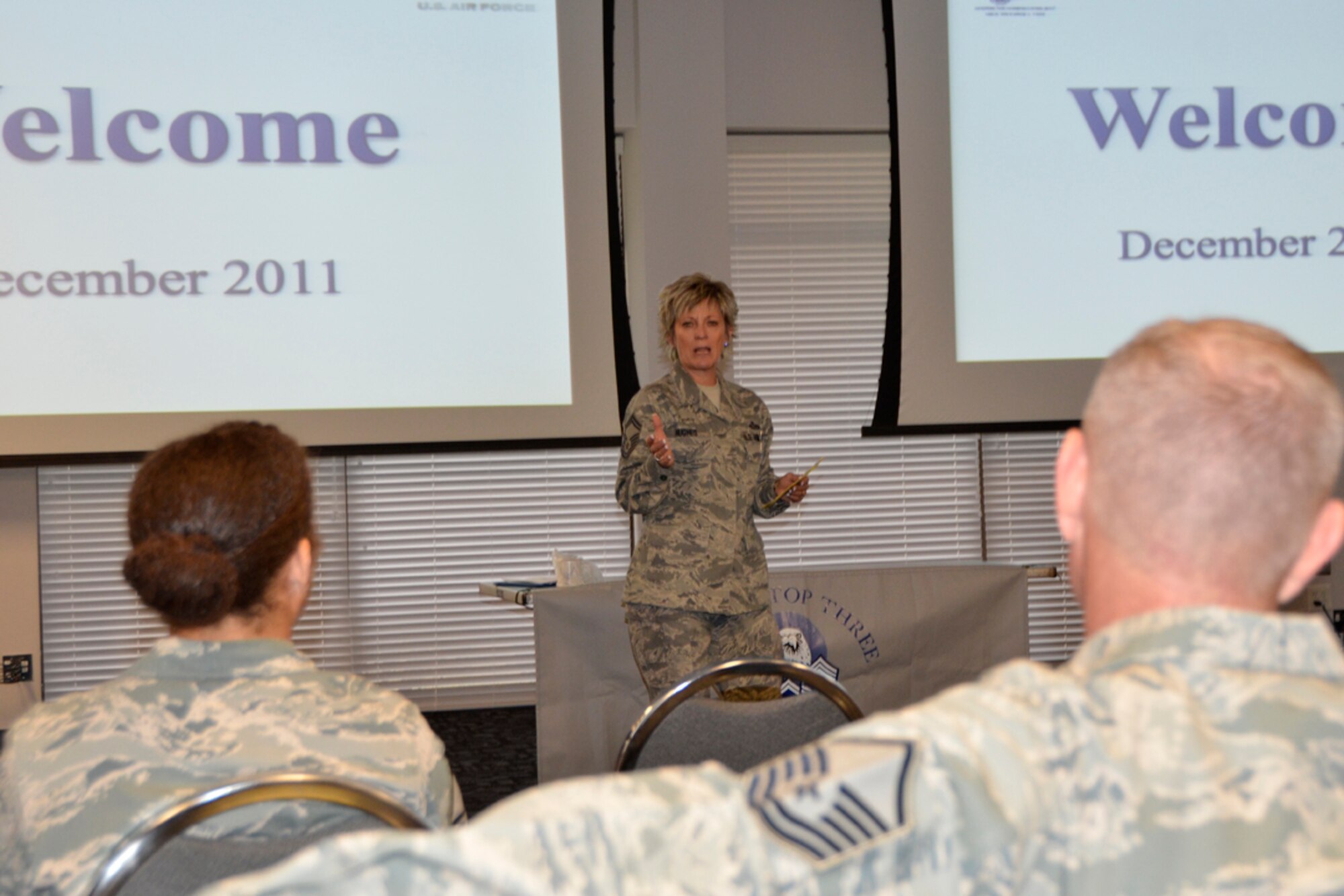 Senior Master Sgt. Joyce Hughes, 94th Airlift Wing Education Office chief and Top Three president-elect, address members of the Top Three Dec. 4. “It’s all about mentoring,” said Hughes, president-elect. “I was once a paper-member of the Top 3. I paid my dues and was not much involved. All that has changed; I love being a member of this organization.” (U.S. Air force photo/Master Sgt. James Branch)
